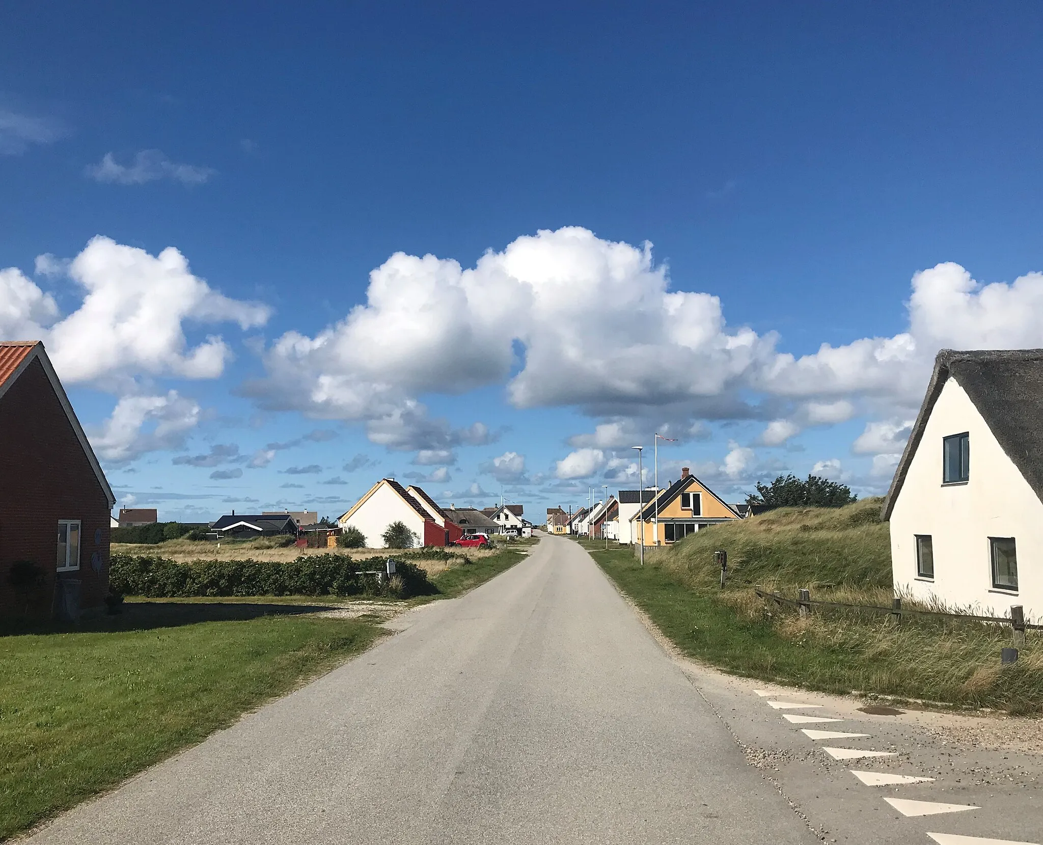 Photo showing: Main street in the village of Lildstrand. Street leads to the harbour at the North Sea shore.