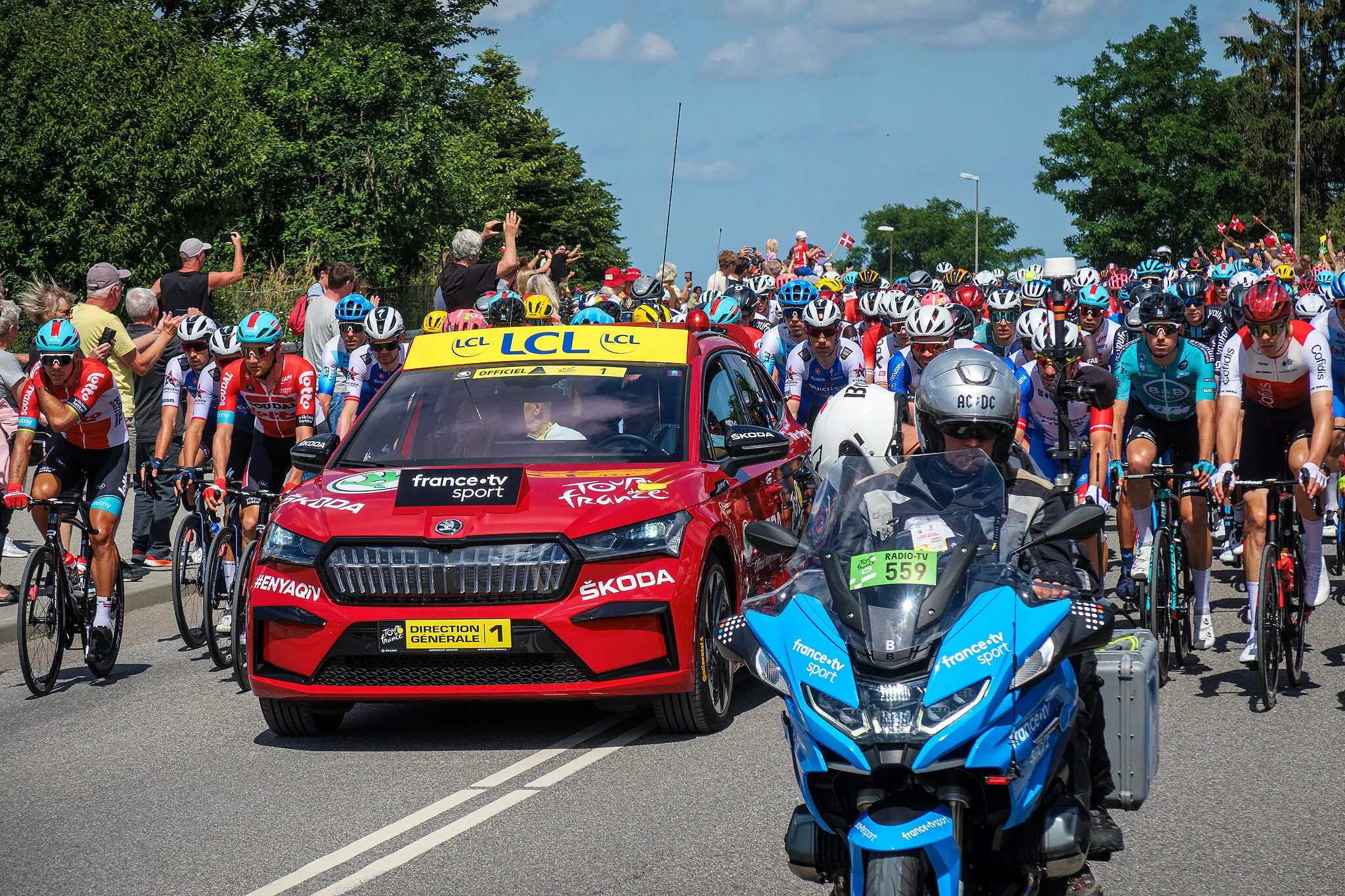 Photo showing: The rolling start "parade" from Roskilde city. Tour de France 2022, stage 2.

I was spending most of my time these days on the Roskilde Festival. But we did get this short glimpse of the riders from the start-parade.