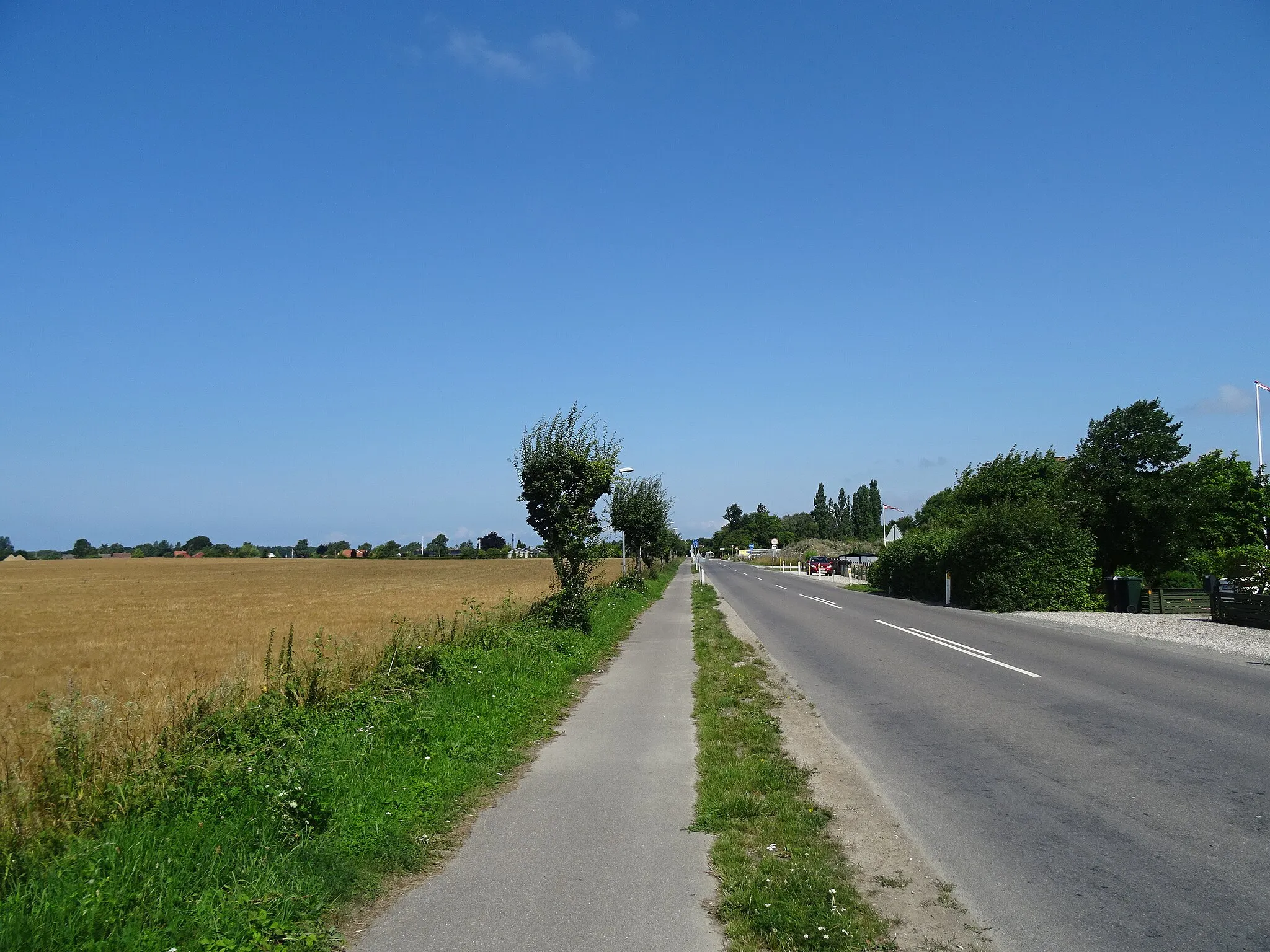 Photo showing: The street Orehoved Langgade on Falster in Denmark. The two-way cycle lane is a part of the national cycling route 7 while the road is a part of the secondary route 153.