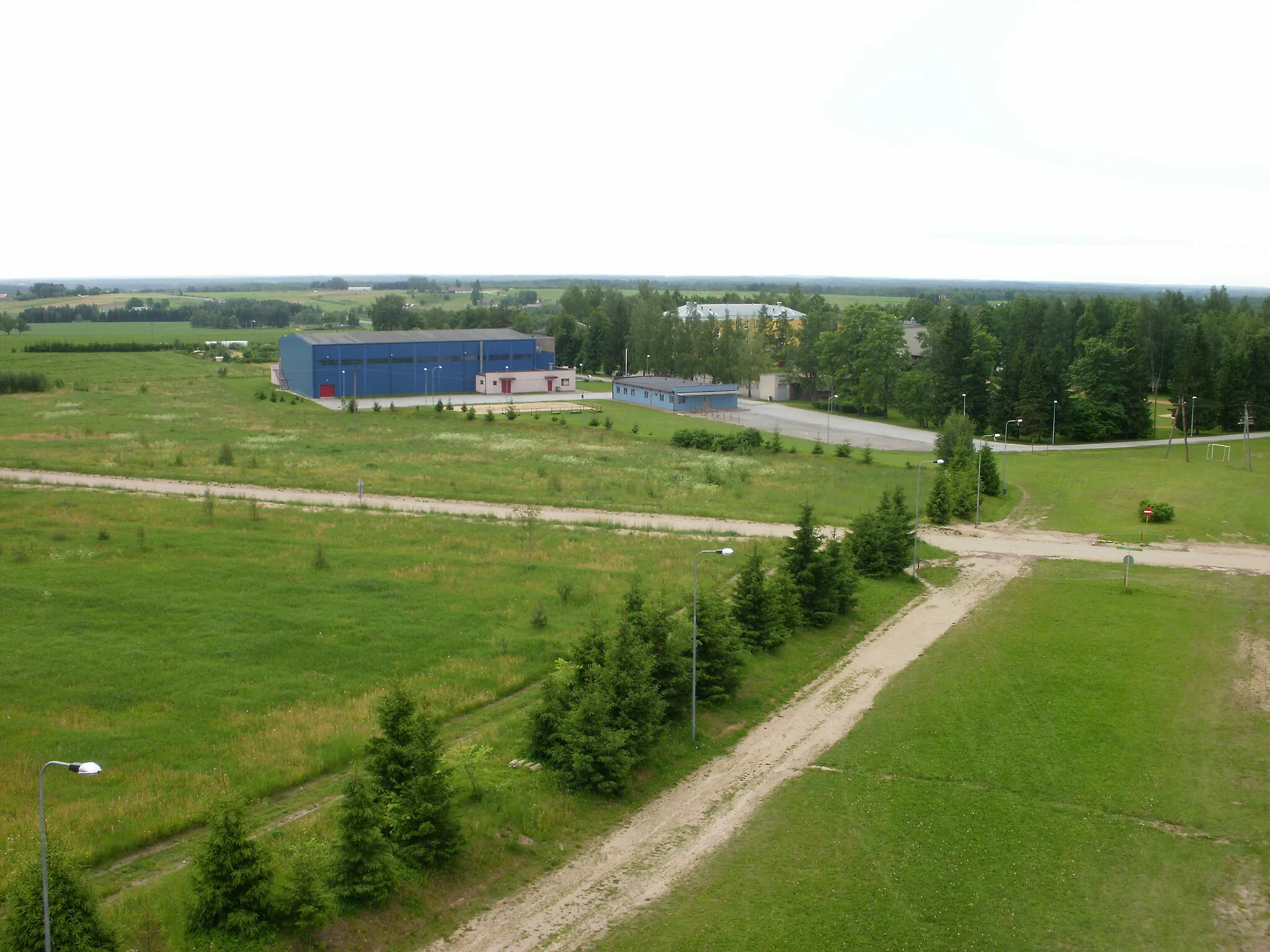Photo showing: Lähte sports hall, between trees Lähte school. View from watch tower. Estonia (2010)