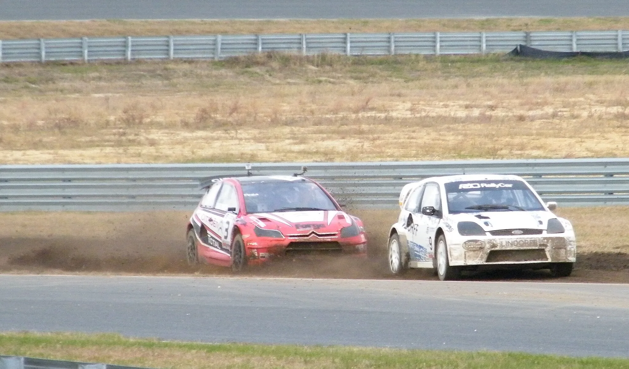 Photo showing: Liam Doran chasing Jussi Pinomäki at Round 3 of the 2010 U.S. RallyCar Rallycross Series at New Jersey Motorsports Park.