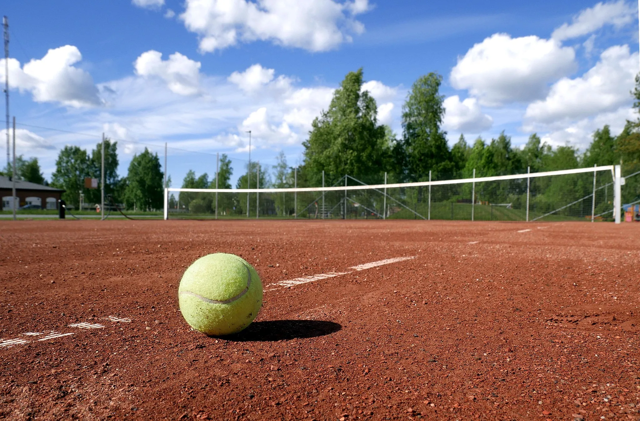 Photo showing: Tennis ball on tennis court.