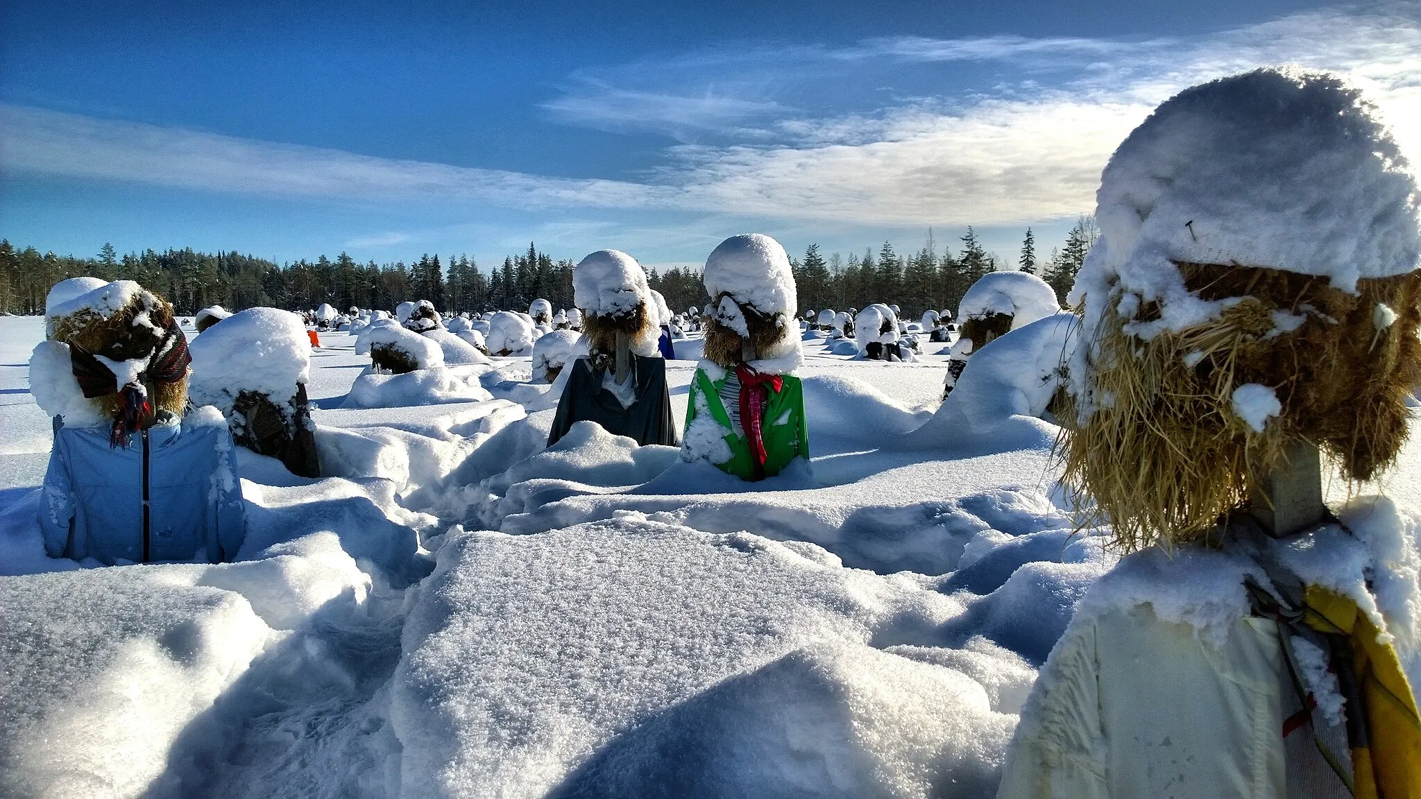 Photo showing: A crowd of frozen figures standing in a field near Suomussalmi, northern Finland