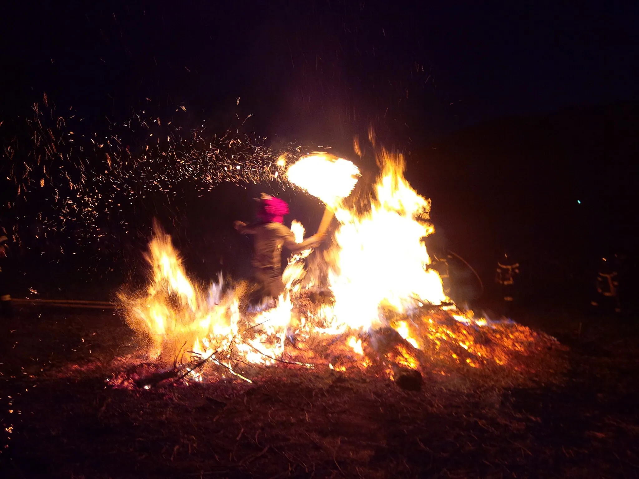 Photo showing: Young guys walking through the wall of fire ( firewall )  traditional prove of fearless in Alsace