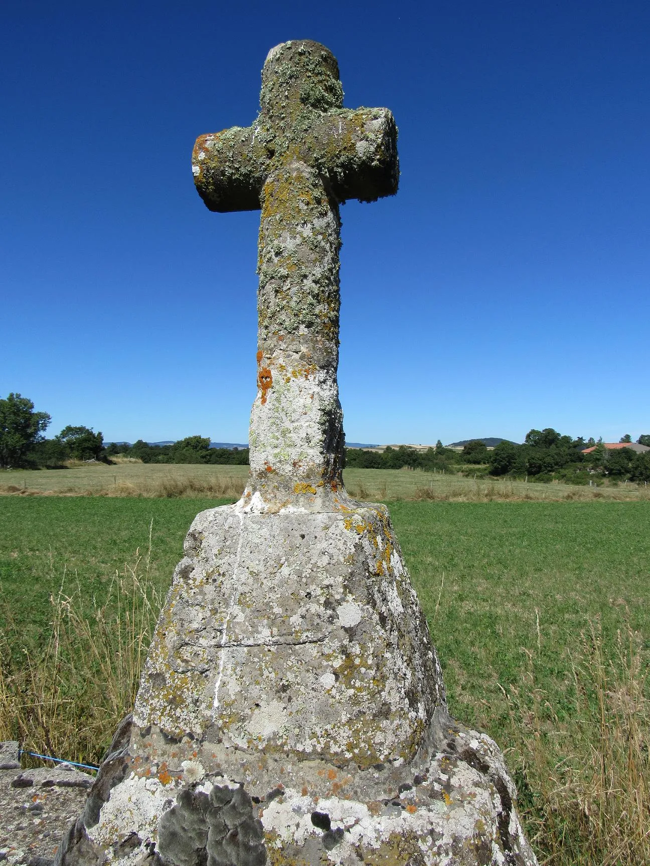 Photo showing: old stone christian cross with cisors engraving