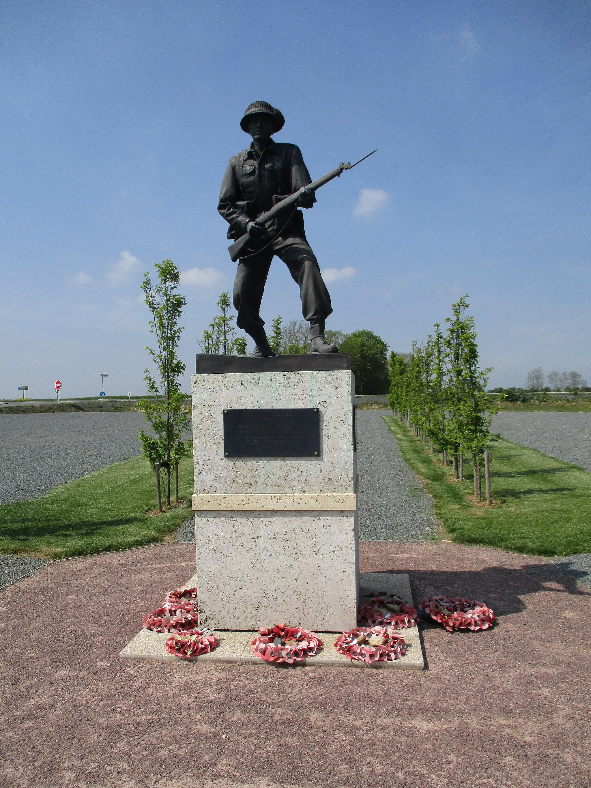 Photo showing: The monument commemorates the bitter fighting that took place for Hill 112 in July 1944. The site contains a British Churchill tank, a 25 Pounder Gun, a general memorial to servicemen and a specific memorial to the 43rd (Wessex) Division.