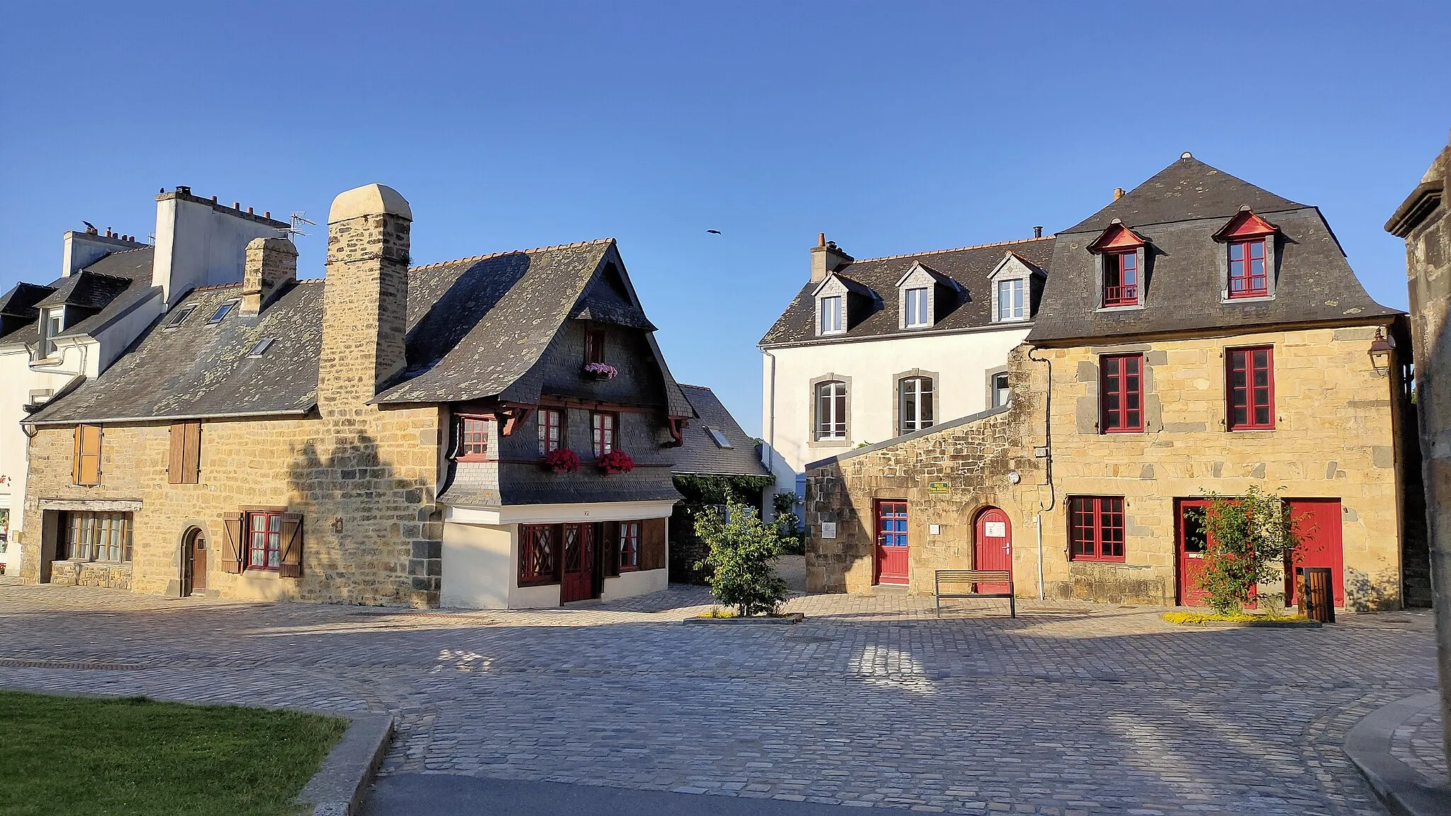 Photo showing: This heritage registered house is emblematic of the several "pan de bois" houses in the historical center. This house is located nearby a common room used by locals for gathering and activities