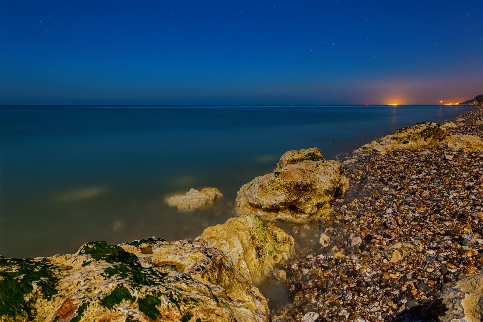 Photo showing: 500px provided description: A night shooting at Aquacaux, a fish farm down from Octeville-sur-Mer's cliffs [#night ,#stars ,#france ,#seascape ,#cliff ,#seaside ,#seashore ,#normandy ,#nightscape ,#startrail ,#landslide ,#Night photography ,#Popular Tags]