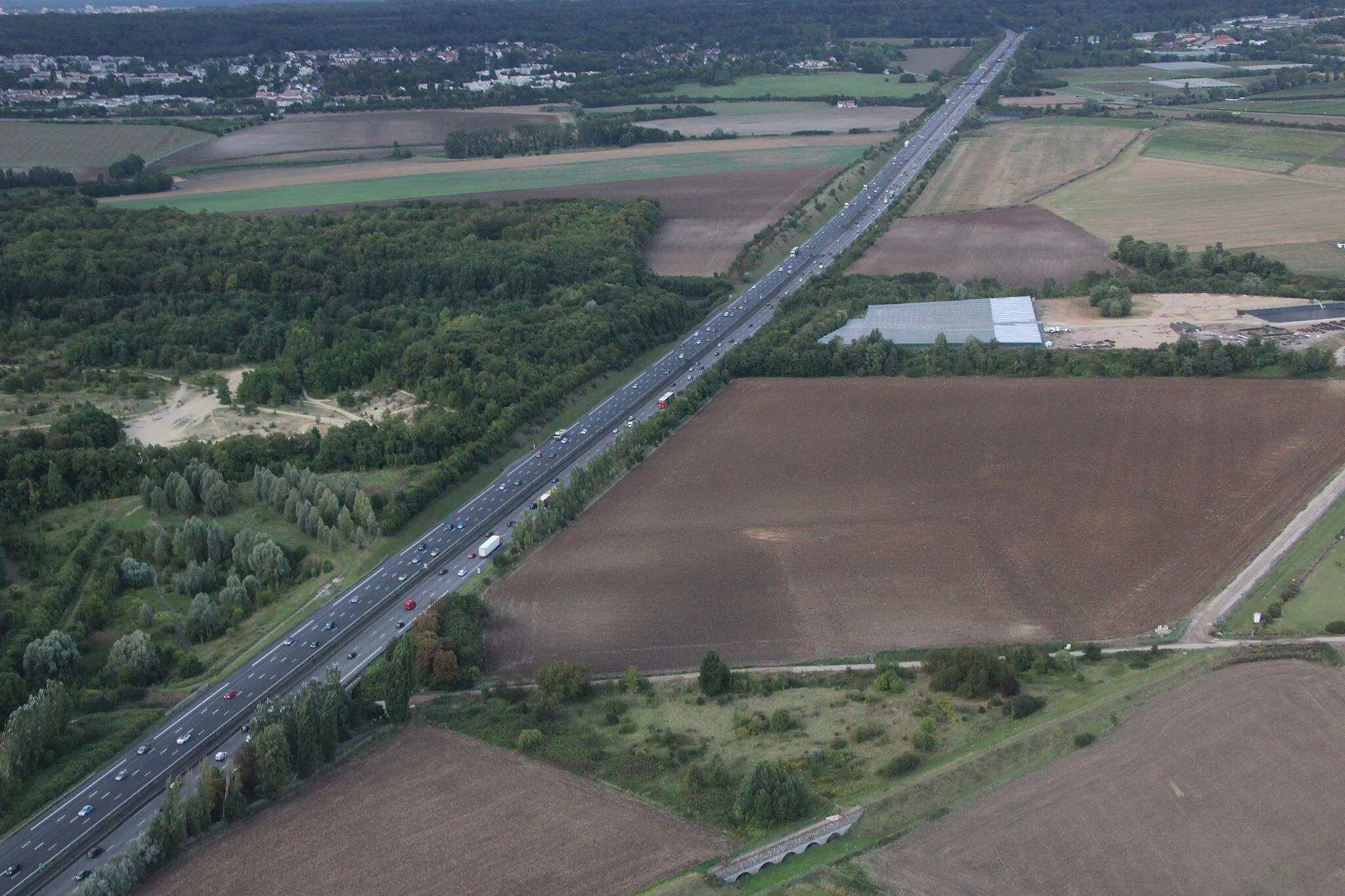 Photo showing: A12 highway seen from a plane in the communes of Saint-Cyr-l'École and Bailly, Yvelines, France.