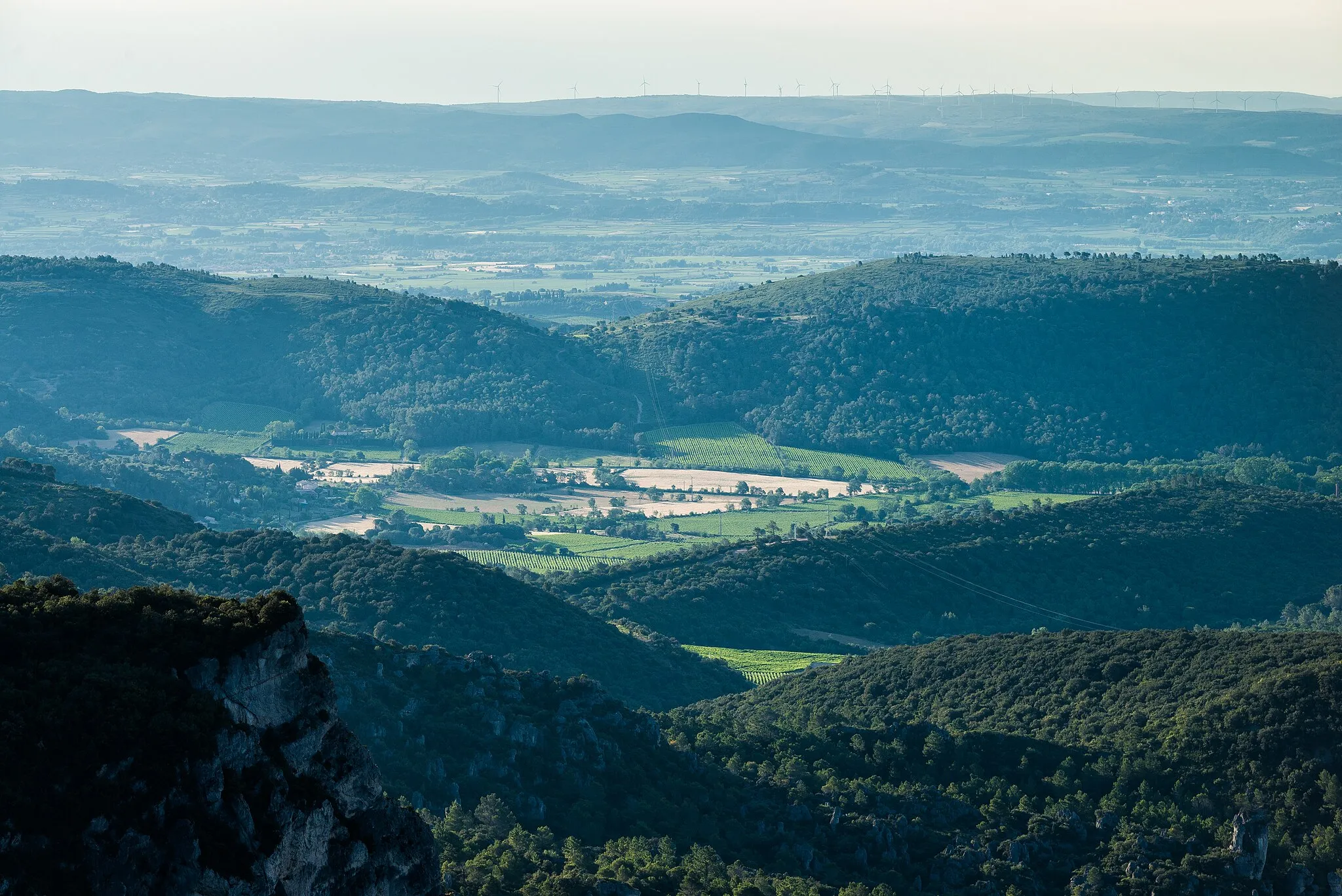 Photo showing: Fields and hills in the commune of Villeneuvette. Photo taken from the Northwest on the Mountain of Liausson in the commune of Liausson, Hérault, France.