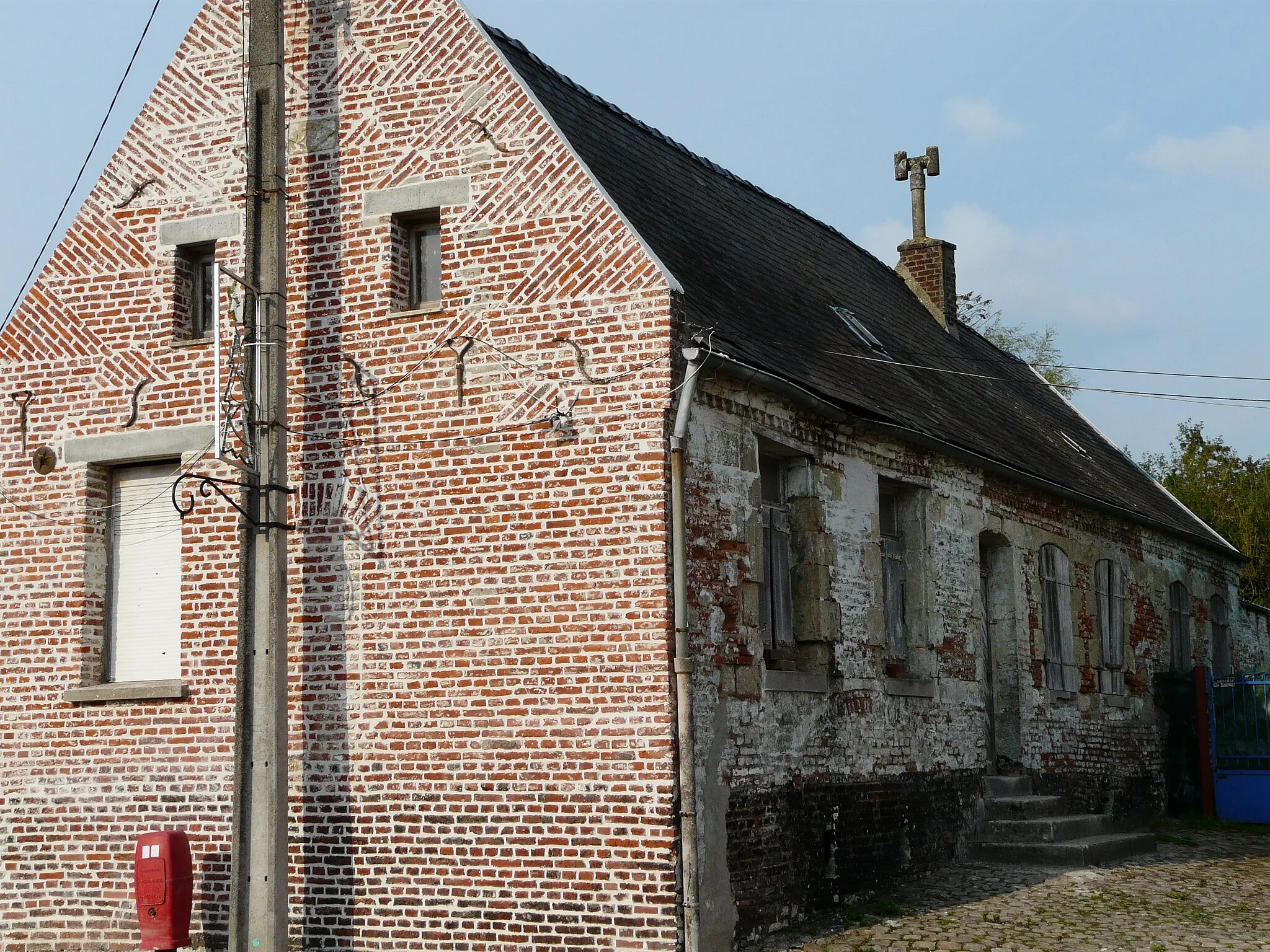 Photo showing: Maison de mulquinier à Ligny-en-Cambrésis (Nord) : blocure visible sur la façade