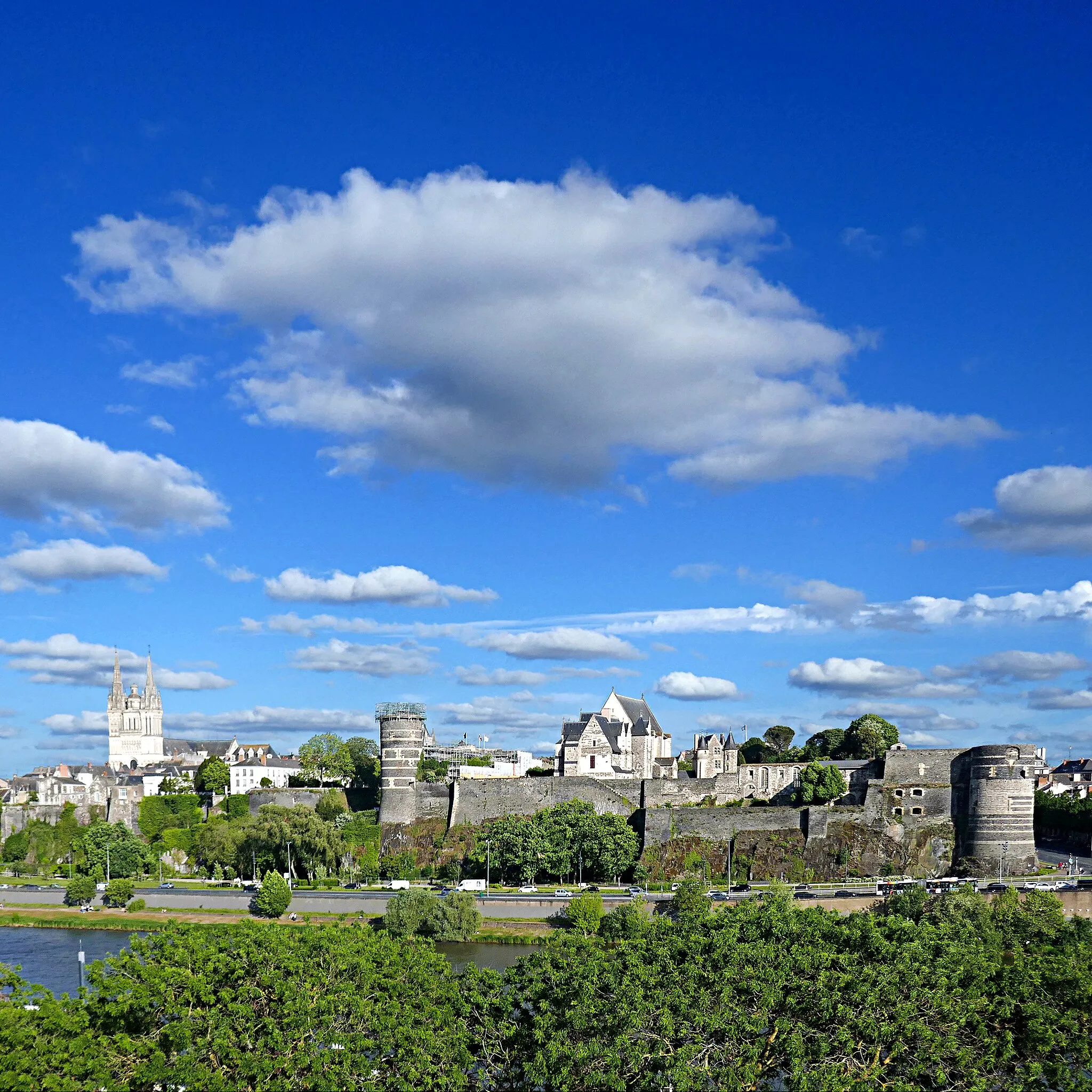 Photo showing: Château d'Angers, aussi appelé château des ducs d'Anjou.

(13ème- 16ème s. - Classé MH 1875, 1913)

Saint Louis fait construire le château actuel au 13ème siècle tandis que les ducs d'Anjou le transforment en résidence seigneuriale au 15ème siècle. Yolande d'Aragon y donne naissance à René d'Anjou. Au 16ème siècle, à la suite des guerres de Religion, Henri III ordonne la destruction du château, mais seule la partie supérieure des tours est détruite (...)

" rel="noreferrer nofollow">fr.wikipedia.org/wiki/Ch%C3%A2teau_d%27Angers

" rel="noreferrer nofollow">en.wikipedia.org/wiki/Ch%C3%A2teau_d%27Angers
Cathédrale Saint-Maurice d'Angers (12ème et 13ème siècles ; flèches du 16ème siècle - classée MH, 1862)

" rel="noreferrer nofollow">fr.wikipedia.org/wiki/Cath%C3%A9drale_Saint-Maurice_d%27A...
en.wikipedia.org/wiki/Angers_Cathedral

May 2022 - Edited and uploaded 2022/05/21