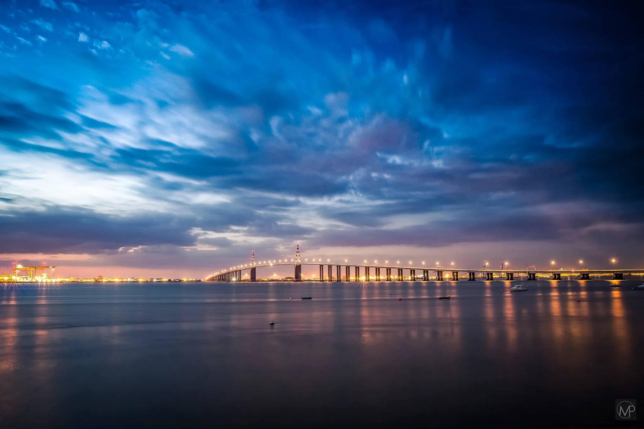 Photo showing: 500px provided description: pont de Saint Nazaire [#sky ,#city ,#sea ,#sunset ,#water ,#blue ,#night ,#light ,#clouds ,#ocean ,#architecture ,#bridge ,#france ,#seascape ,#landscapes ,#long exposure ,#pont ,#estuaire ,#saintnazaire]