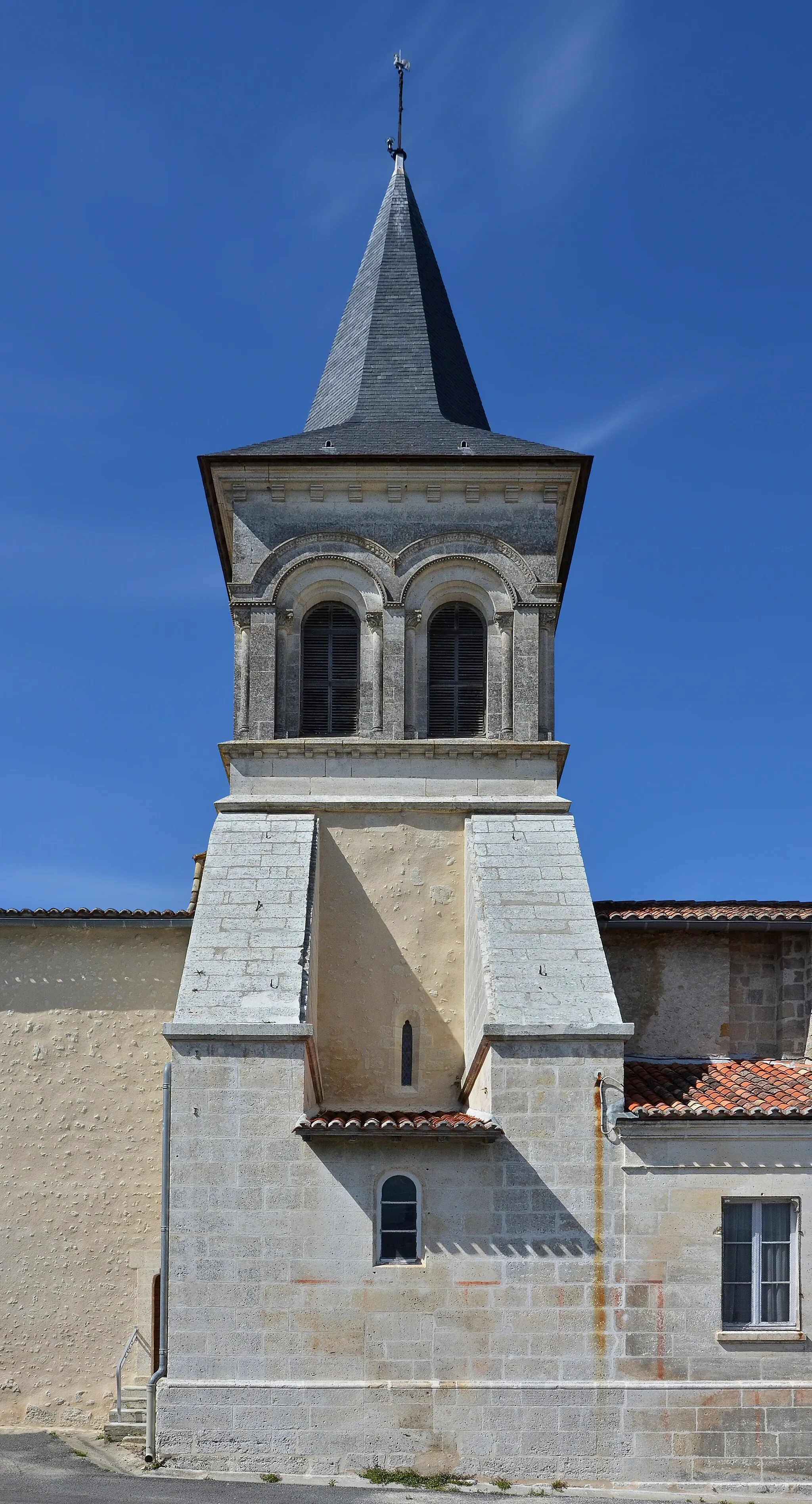 Photo showing: Clock tower and buttress walls, church of Salles-Lavalette, Charente, France.