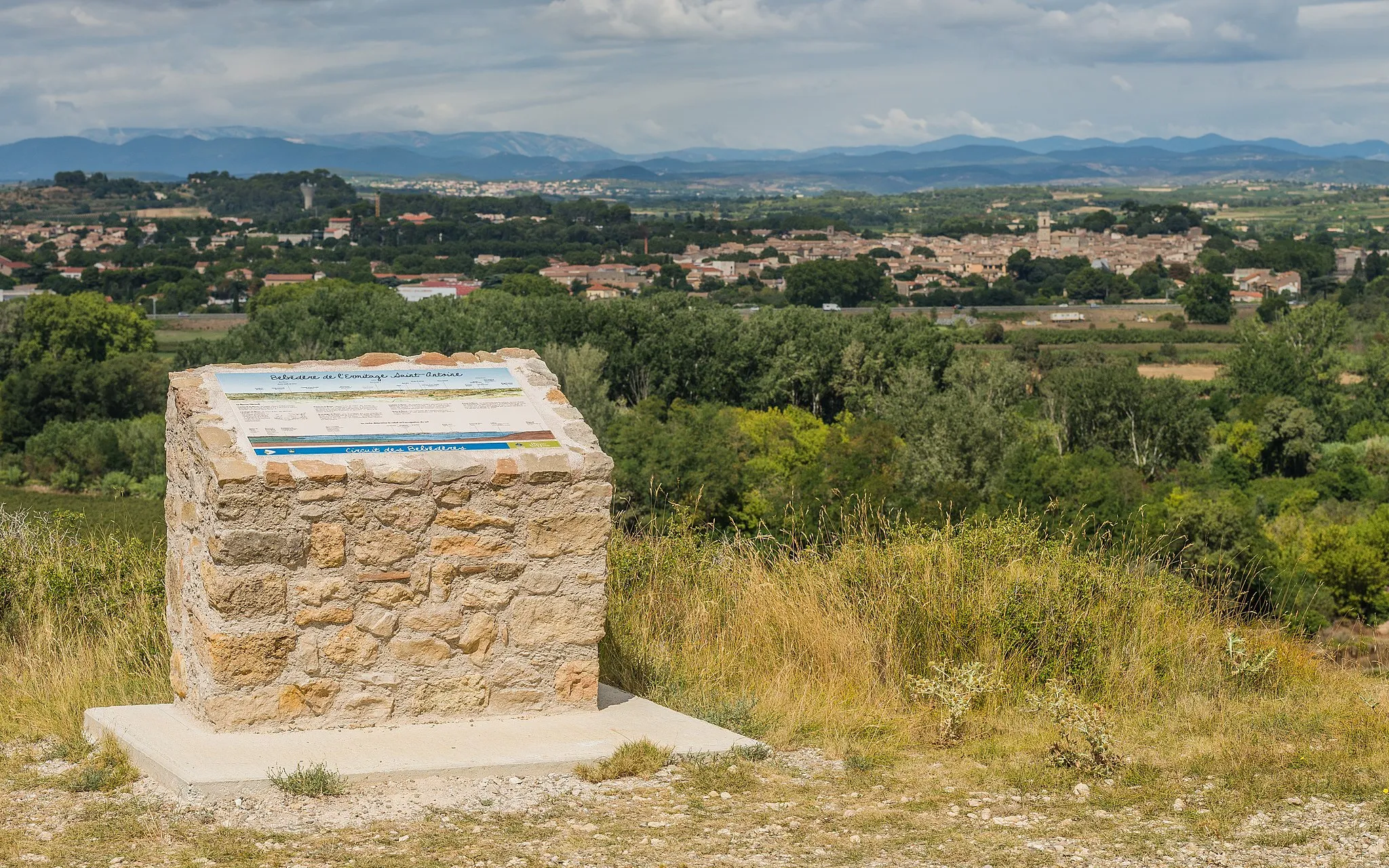 Photo showing: An orientation table and the village of Pézenas in the background. Castelnau-de-Guers, Hérault, France.