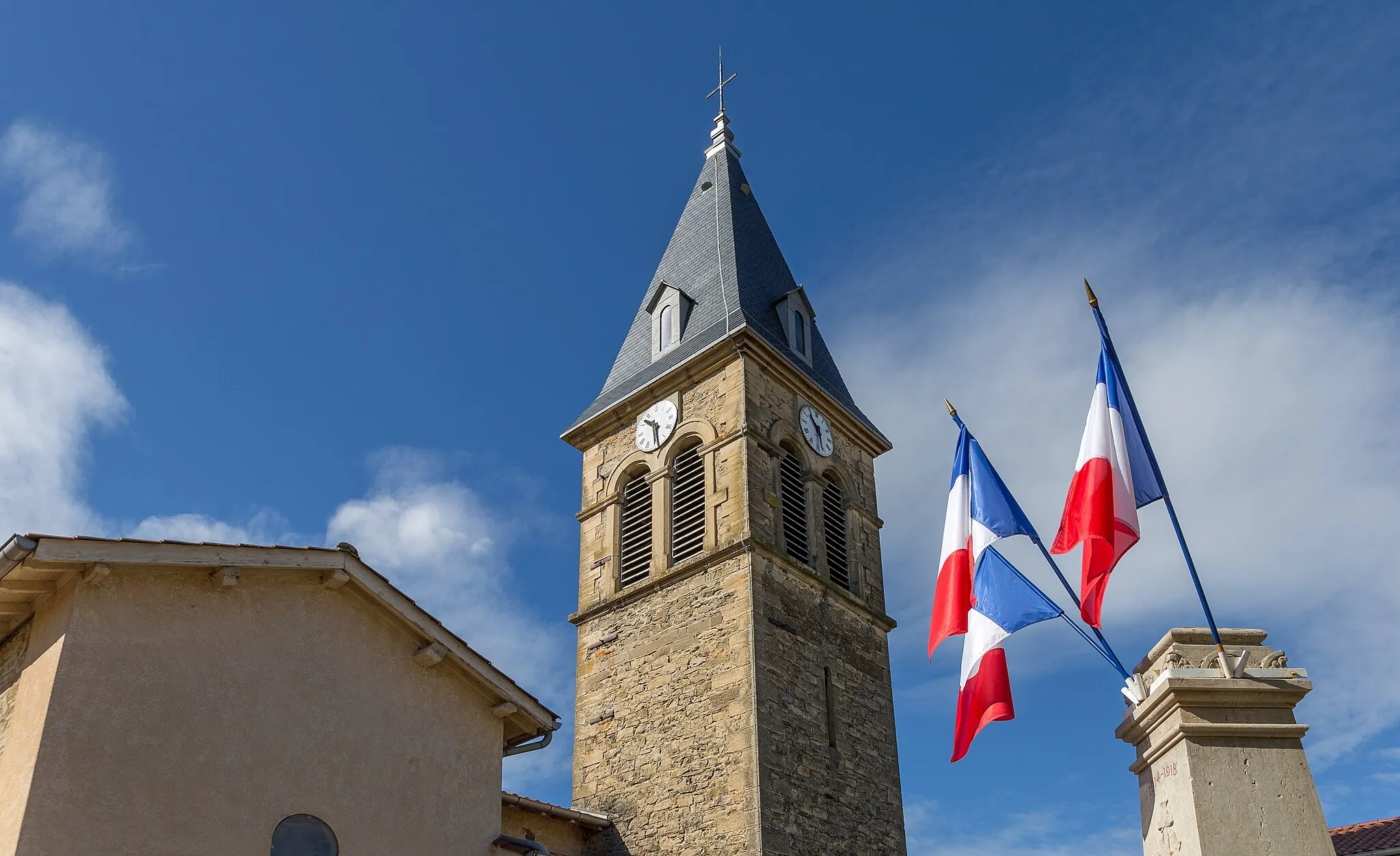Photo showing: Meyrié, Isère. The bell tower of the Saint-Clair church and the flags of the war memorial.