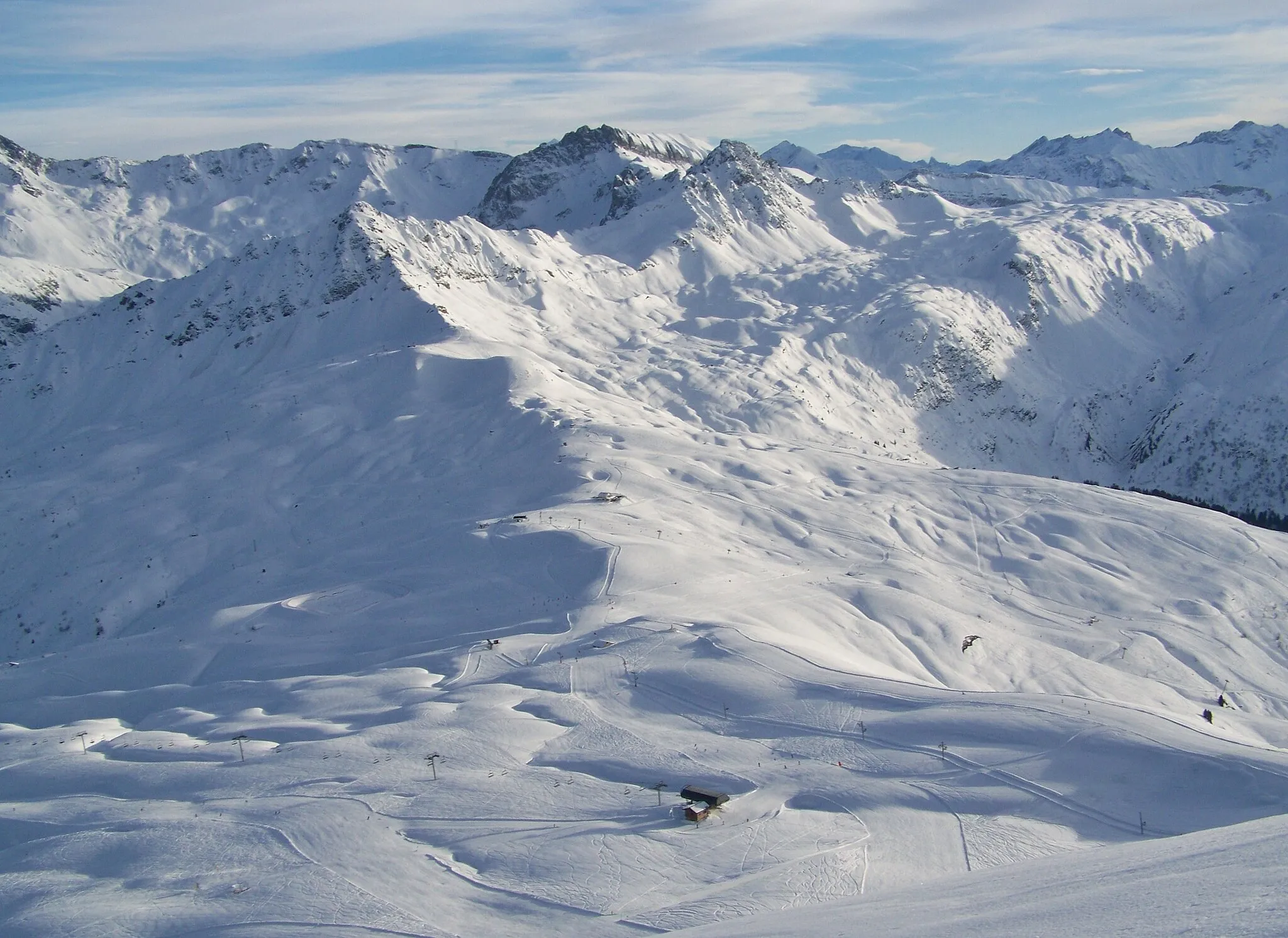 Photo showing: Sight of Les Contamines-Montjoie (left slope) and Hauteluce (right slope) ski resorts and col du Joly pass in Haute-Savoie and Savoie, France.