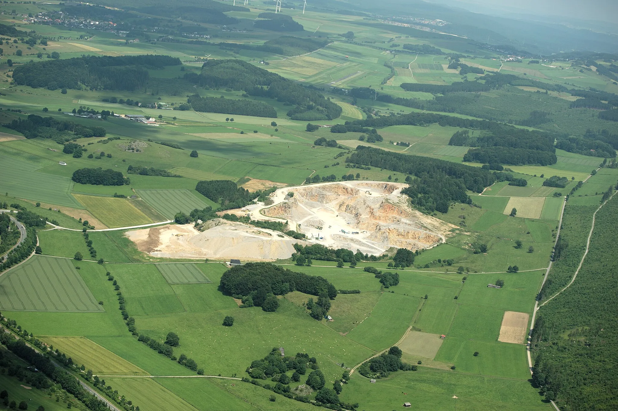 Photo showing: Fotoflug Sauerland-Ost: Landschaft östlich von Brilon mit Steinbruch Kirchloh und einigen Naturschtzgebieten. Natura 2000-Gebiet: Teichgrotte und Ponorhoehle am Kirchloh (DE-4617-304).

The production, editing or release of this file was supported by the Community-Budget of Wikimedia Deutschland.
To see other files made with the support of Wikimedia Deutschland, please see the category Supported by Wikimedia Deutschland.
العربية ∙ বাংলা ∙ Deutsch ∙ English ∙ Esperanto ∙ français ∙ magyar ∙ Bahasa Indonesia ∙ italiano ∙ 日本語 ∙ македонски ∙ മലയാളം ∙ Bahasa Melayu ∙ Nederlands ∙ português ∙ русский ∙ svenska ∙ українська ∙ +/−