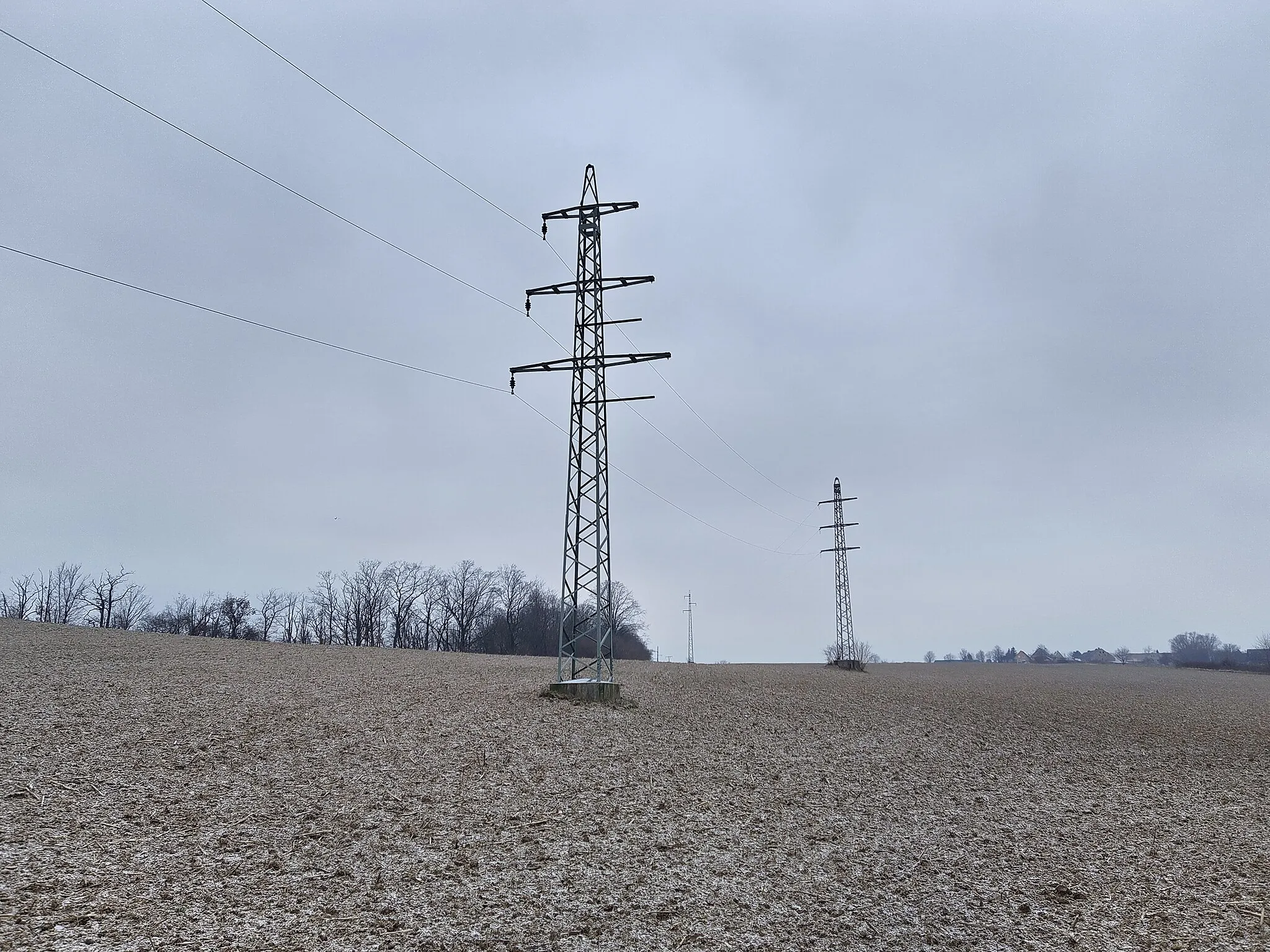 Photo showing: Old transmission tower from the 1920s. Originally, a second system was split from this power line from the second pole.