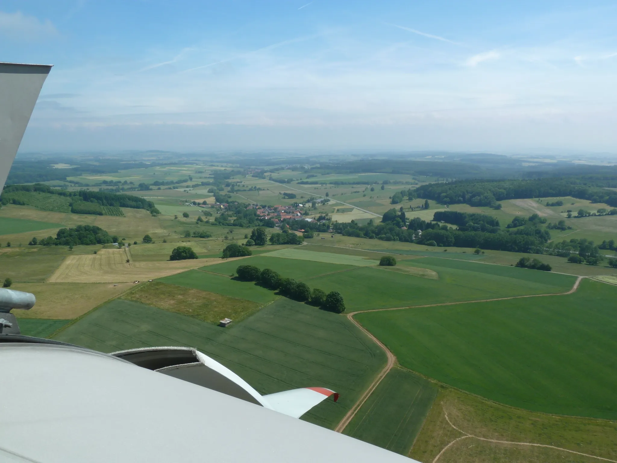 Photo showing: View from Turbine No. 7 in the "Windenergiepark Vogelsberg" wind farm near Hartmannshain (Hesse, Germany) at the village of Voelzberg.