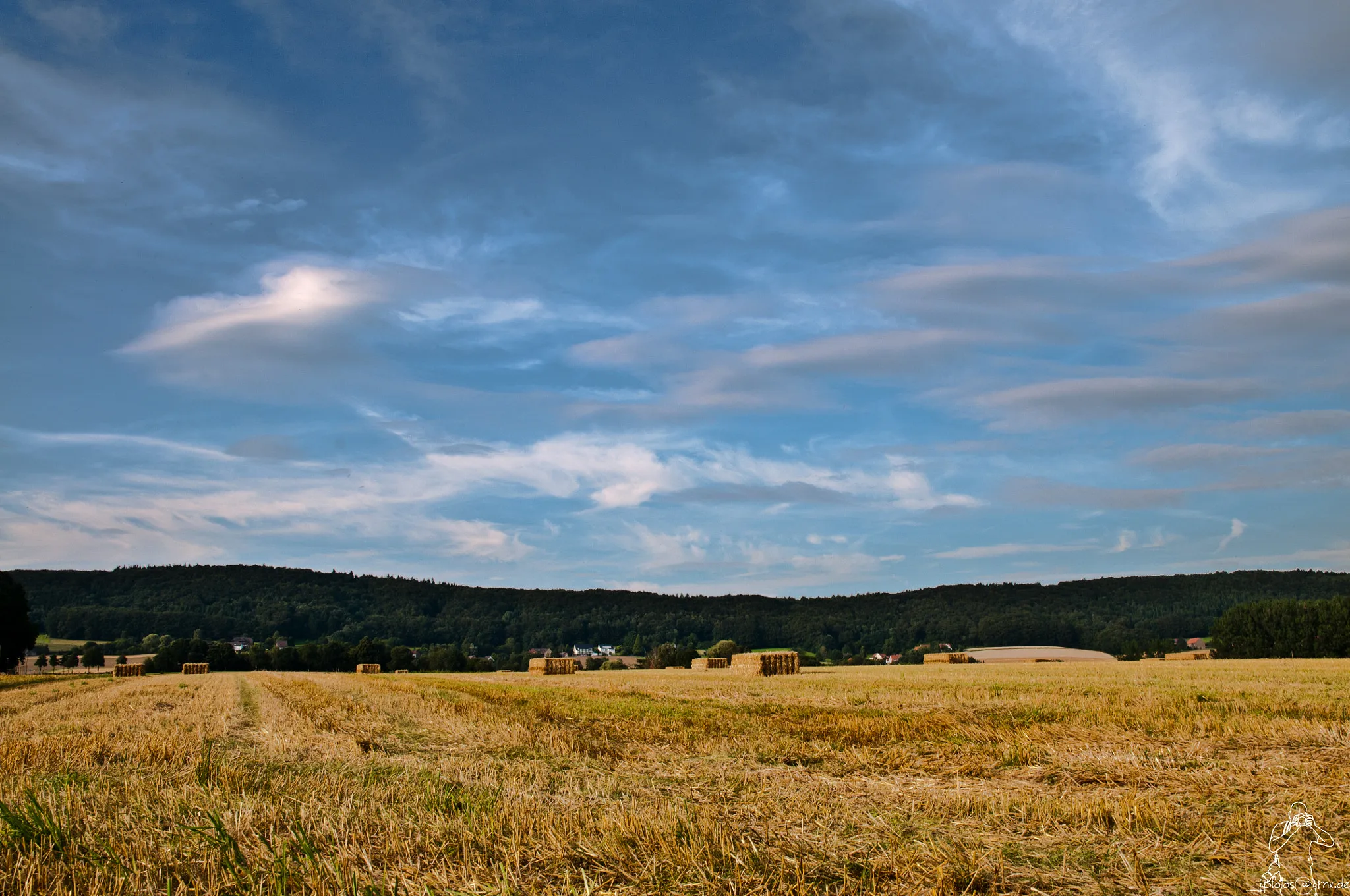 Photo showing: 500px provided description: I too this picture in the evening, while the farme was taking the straw.

I hope you enjoy the lights and the clouds as much as I do. [#field ,#landscape ,#sun ,#light ,#clouds ,#cloudscape ,#cloudy ,#outdoor ,#outside ,#lights ,#summer ,#peaceful ,#landscapes ,#fields ,#countryside ,#peace ,#cloud ,#country ,#farm ,#corn ,#straw ,#august ,#meadow ,#idyllic ,#farming ,#harvest ,#farmland]