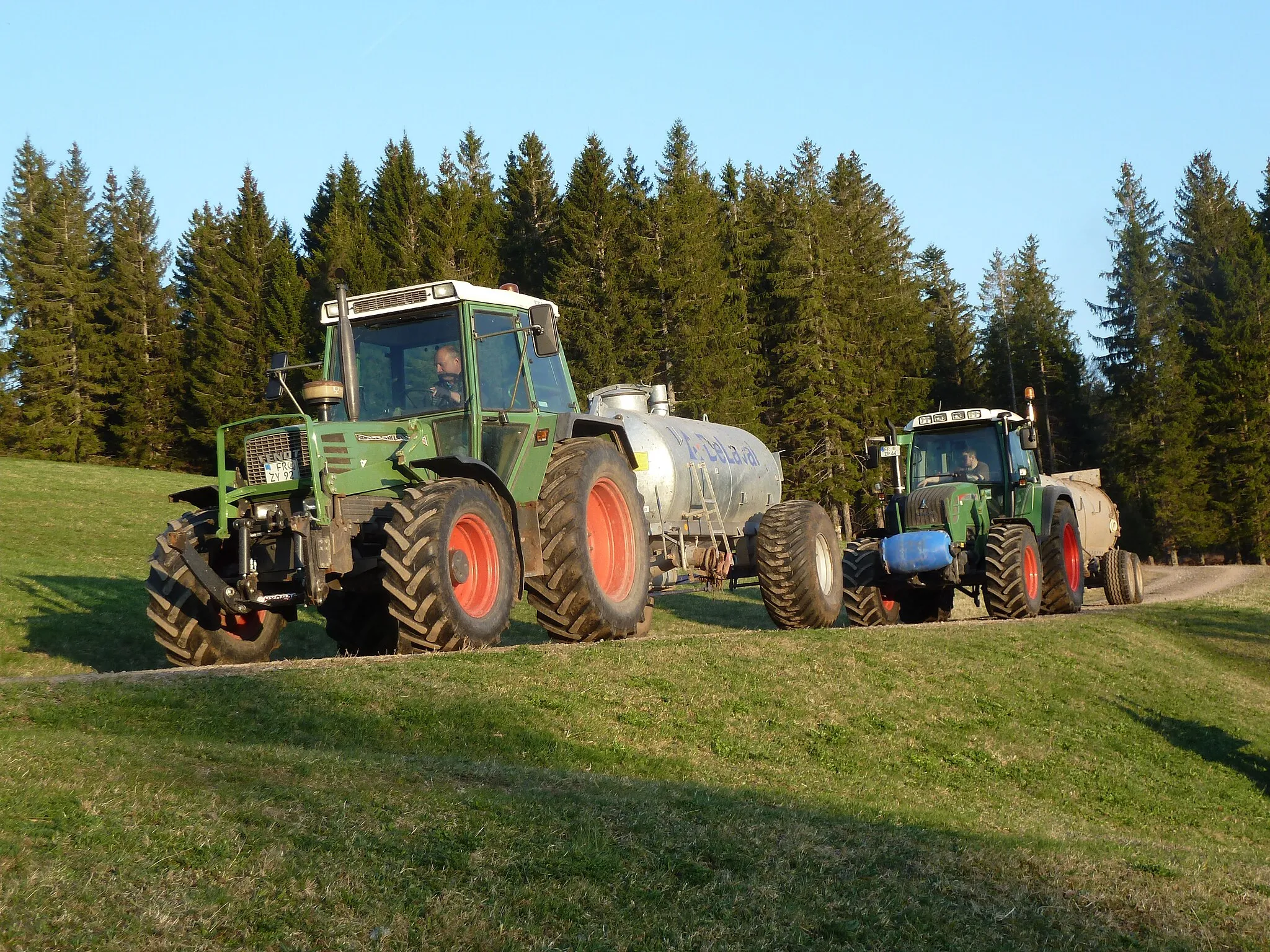 Photo showing: Two Fendt tractors with liquid manure trailers
