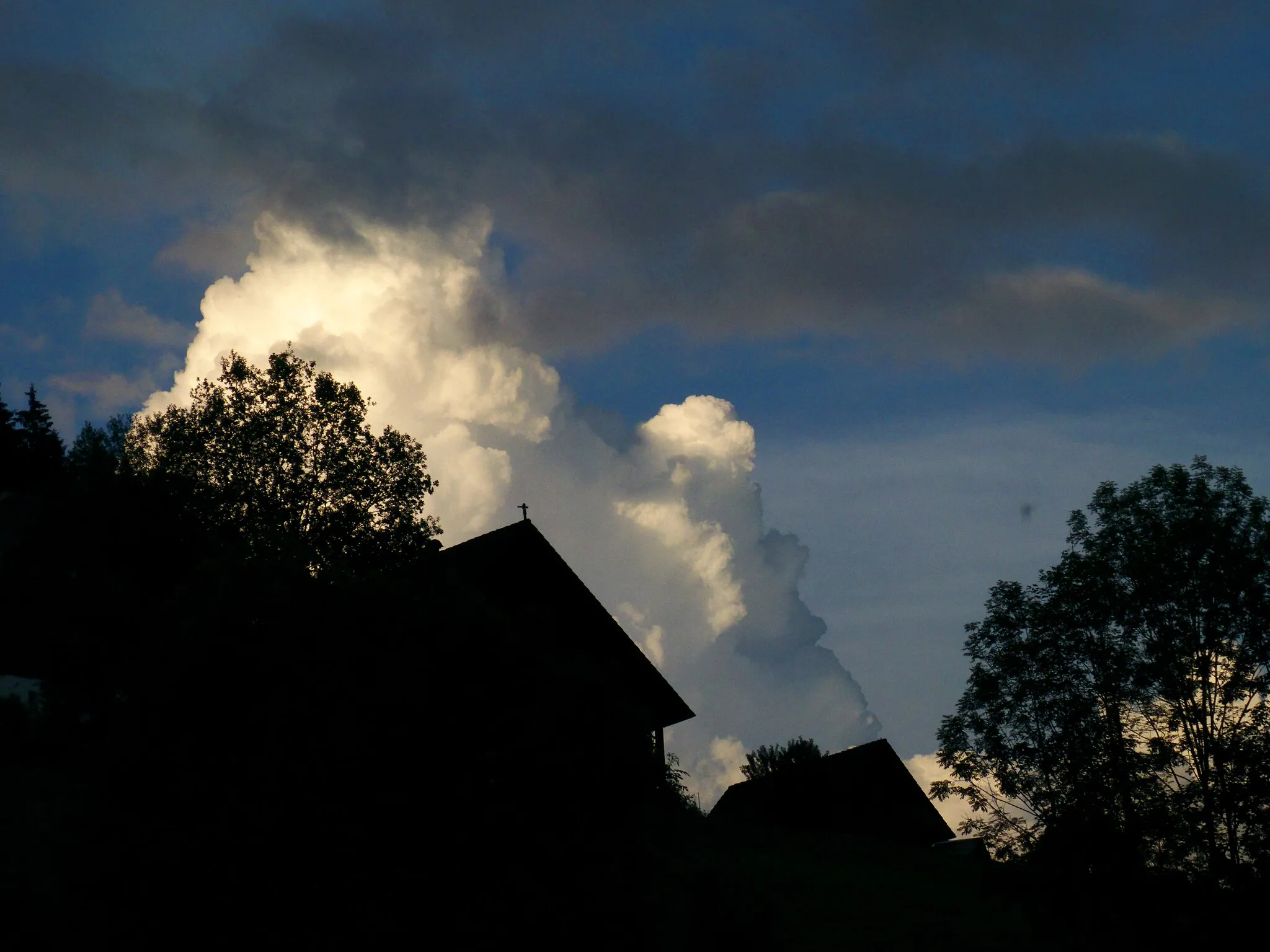 Photo showing: Huts And Clouds