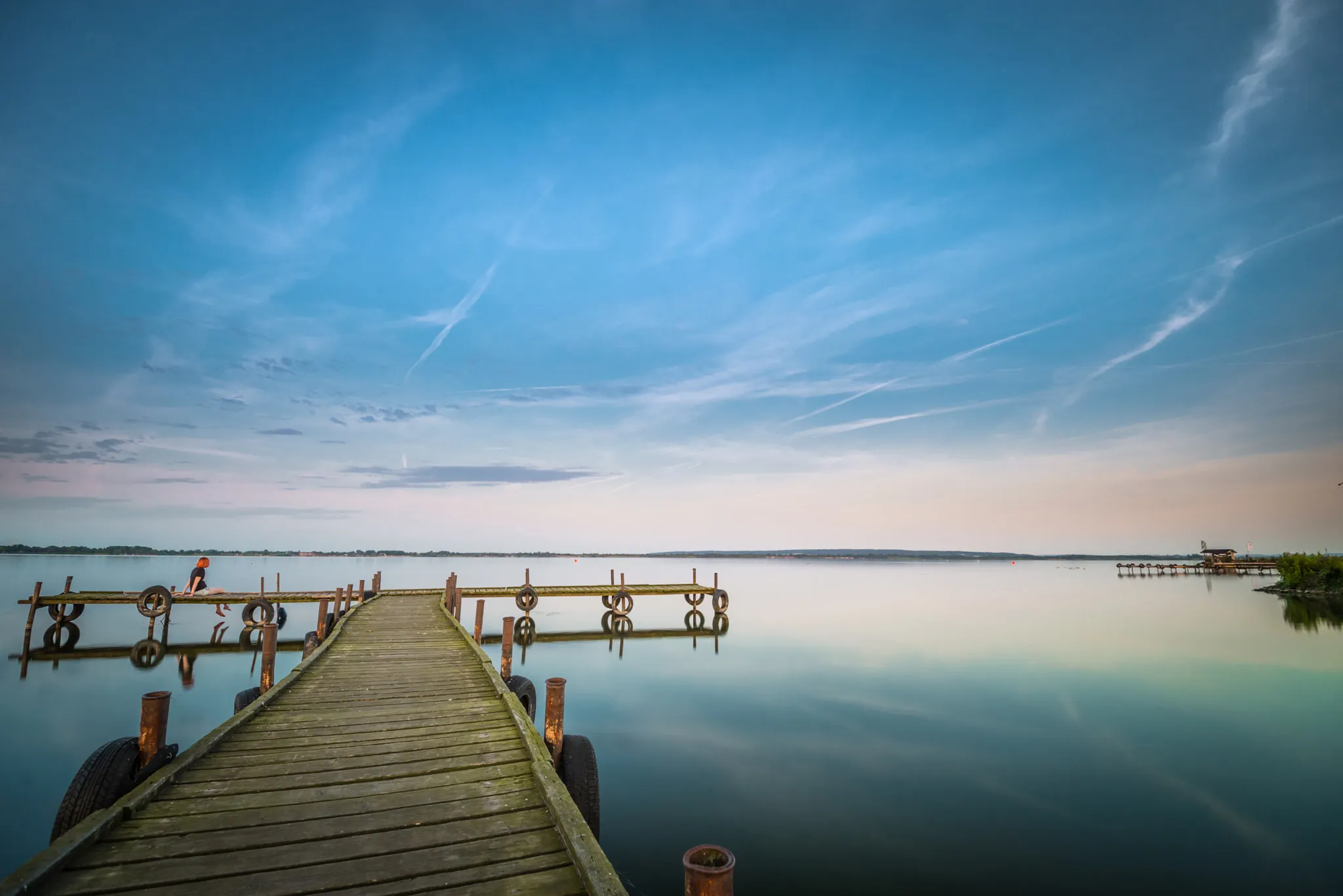 Photo showing: 500px provided description: Entspannte Zeit am D?mmer See. Seit langer Zeit war ich mal wieder da... [#sky ,#landscape ,#lake ,#sea ,#sunset ,#water ,#reflection ,#nature ,#river ,#beach ,#sun ,#light ,#summer ,#person ,#pier ,#dawn ,#cloud ,#blue sky ,#see ,#seashore ,#outdoors ,#dusk ,#jetty ,#landschaft ,#steg ,#landschaftsfotografie ,#d?mmersee ,#d?mmer]