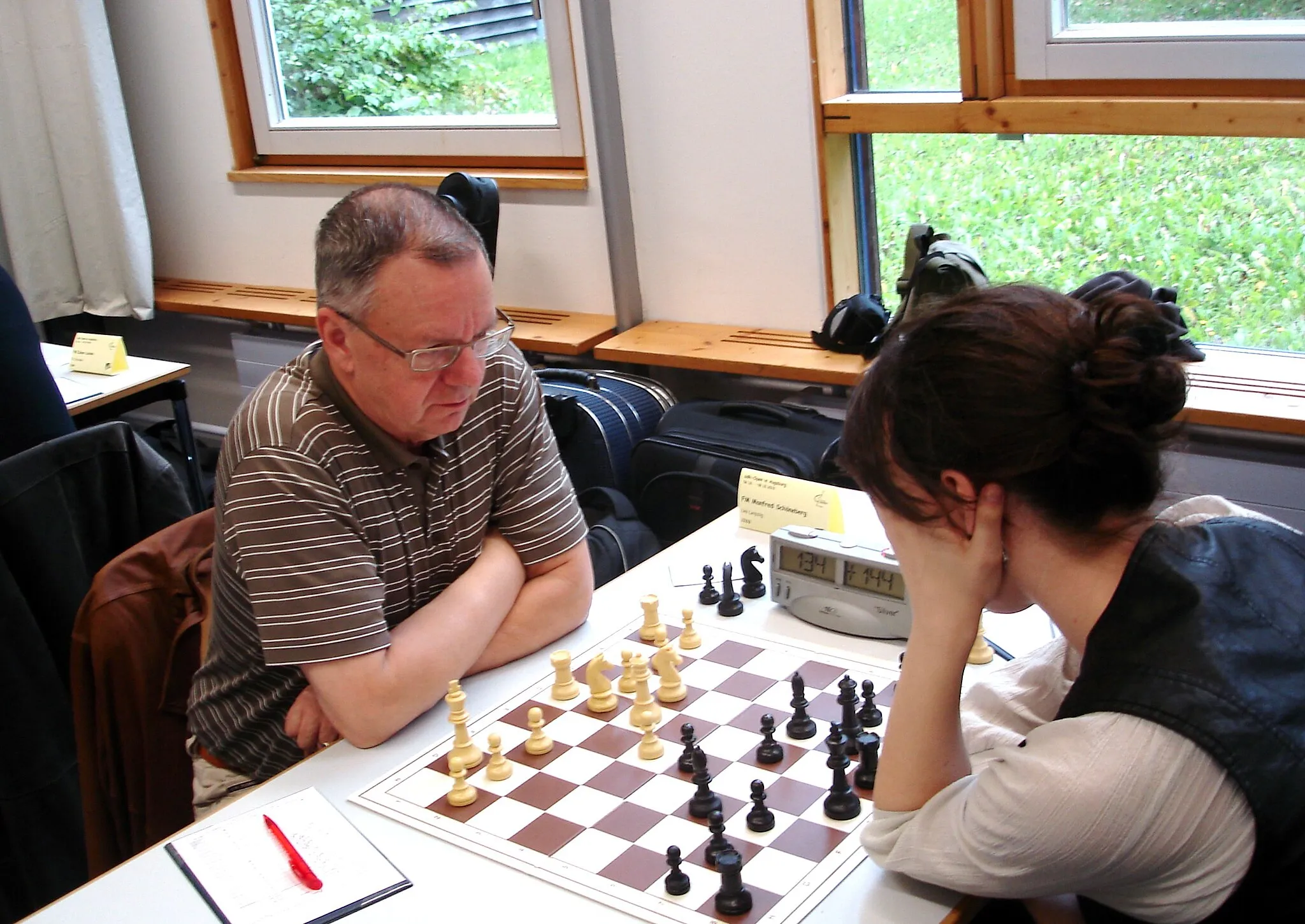 Photo showing: Manfred Schöneberg (born 1946), German chess player and FIDE Master, National Champion of the German Democratic Republic (East Germany) in 1972; Event: Manfred Schöneberg (Universität Leipzig) vs. Agata Sikorska (Politechnika Poznańska), International German University Team Championship, 2010, Augsburg