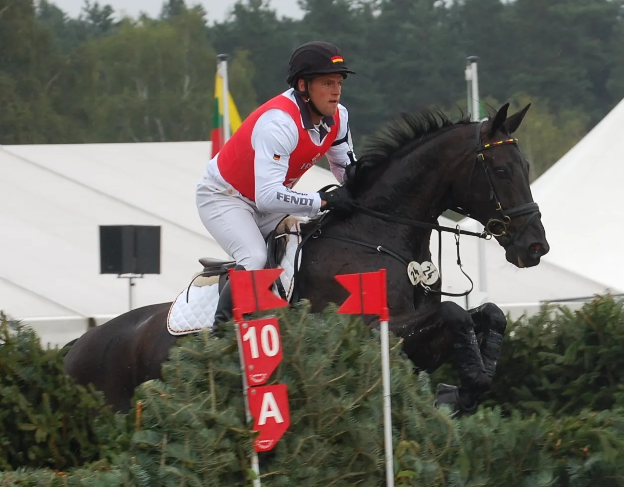 Photo showing: Andreas Ostholt and Franco Jeas, cross-country phase, 2011 European Eventing Championship, Luhmühlen