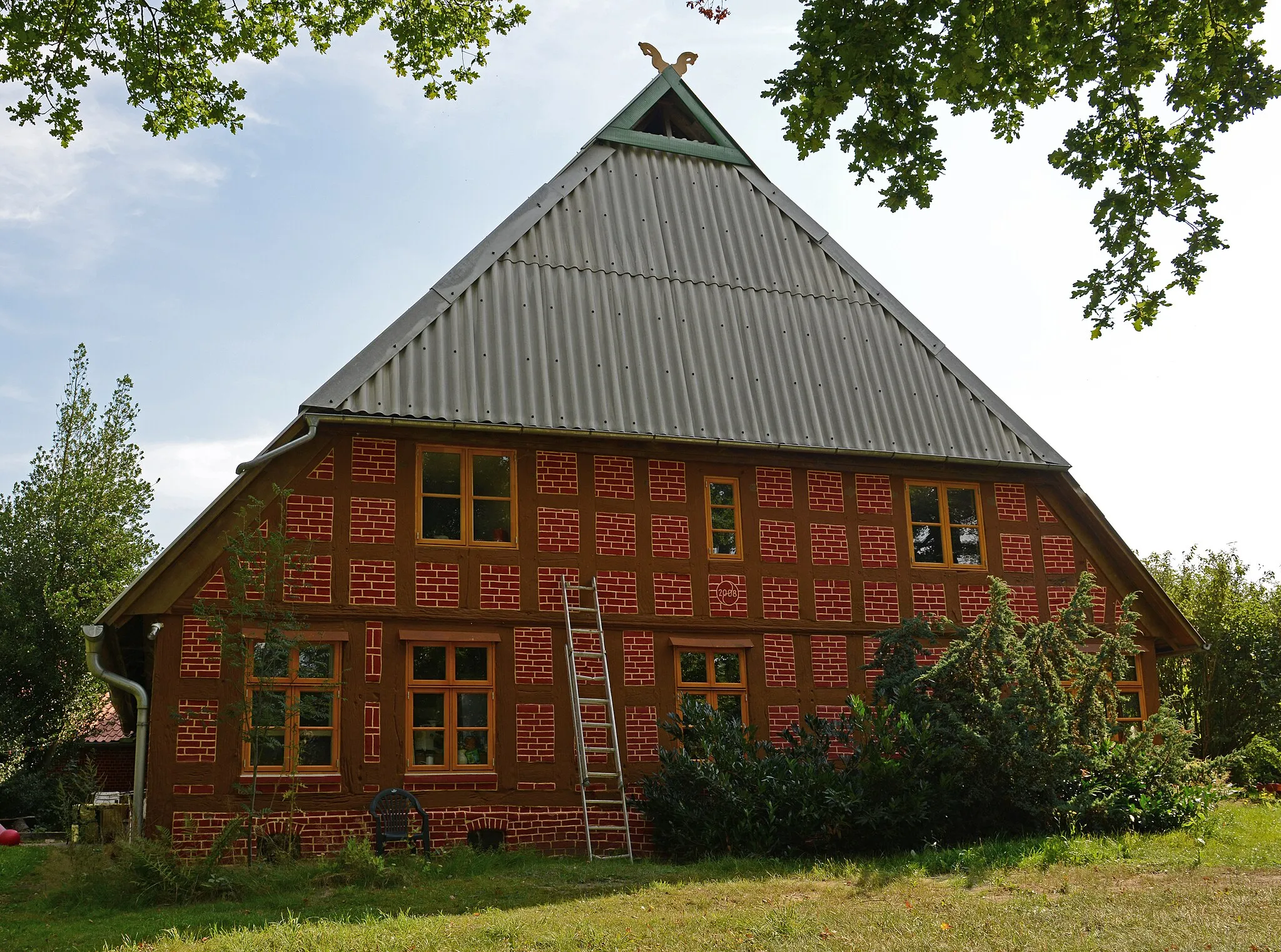 Photo showing: Fußwalmdach, Baudenkmal in Syke Wachendorf Alter Berg 1