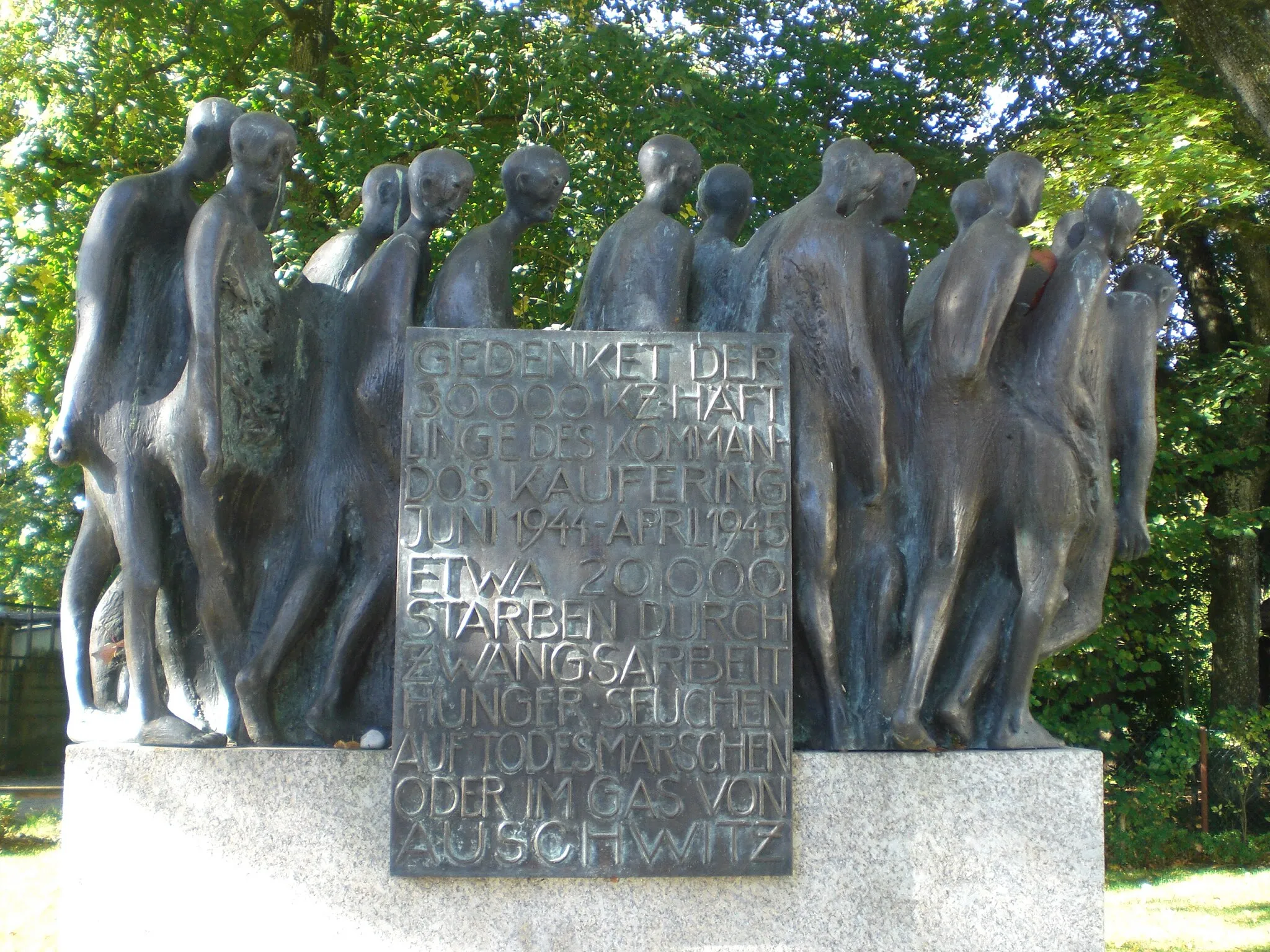 Photo showing: Memorial for KZ victims Kaufering at the train station Kaufering near Landsberg erected in 2010 inscription: remember the 30,000 inmates of the Kaufering command June 1944 - April 1945 About 20,000 died of forced labor, hunger, disease, death marches, or in the gas of Auschwitz. German: Gedenkstele-KZ-Opfer-am-Bahnhofsplatz-Kaufering-bei-Landsberg-2010-Text-Gedenket der 30.000 KZ-Häftlinge des Kommandos Kaufering Juni 1944 - April 1945 Etwa 20.000 starben durch Zwangsarbeit, Hunger, Seuchen, auf Todesmärschen oder im Gas von Auschwitz