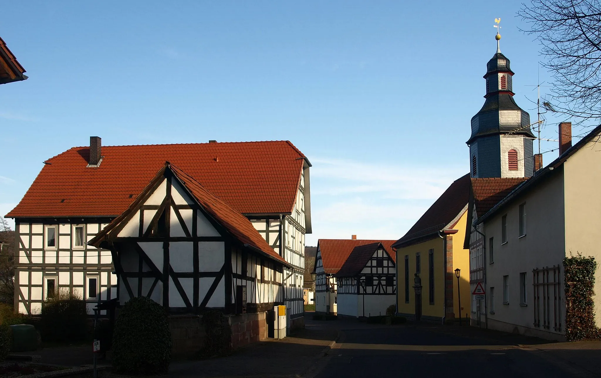 Photo showing: The street called Hauptstrasse with the village church from 1736