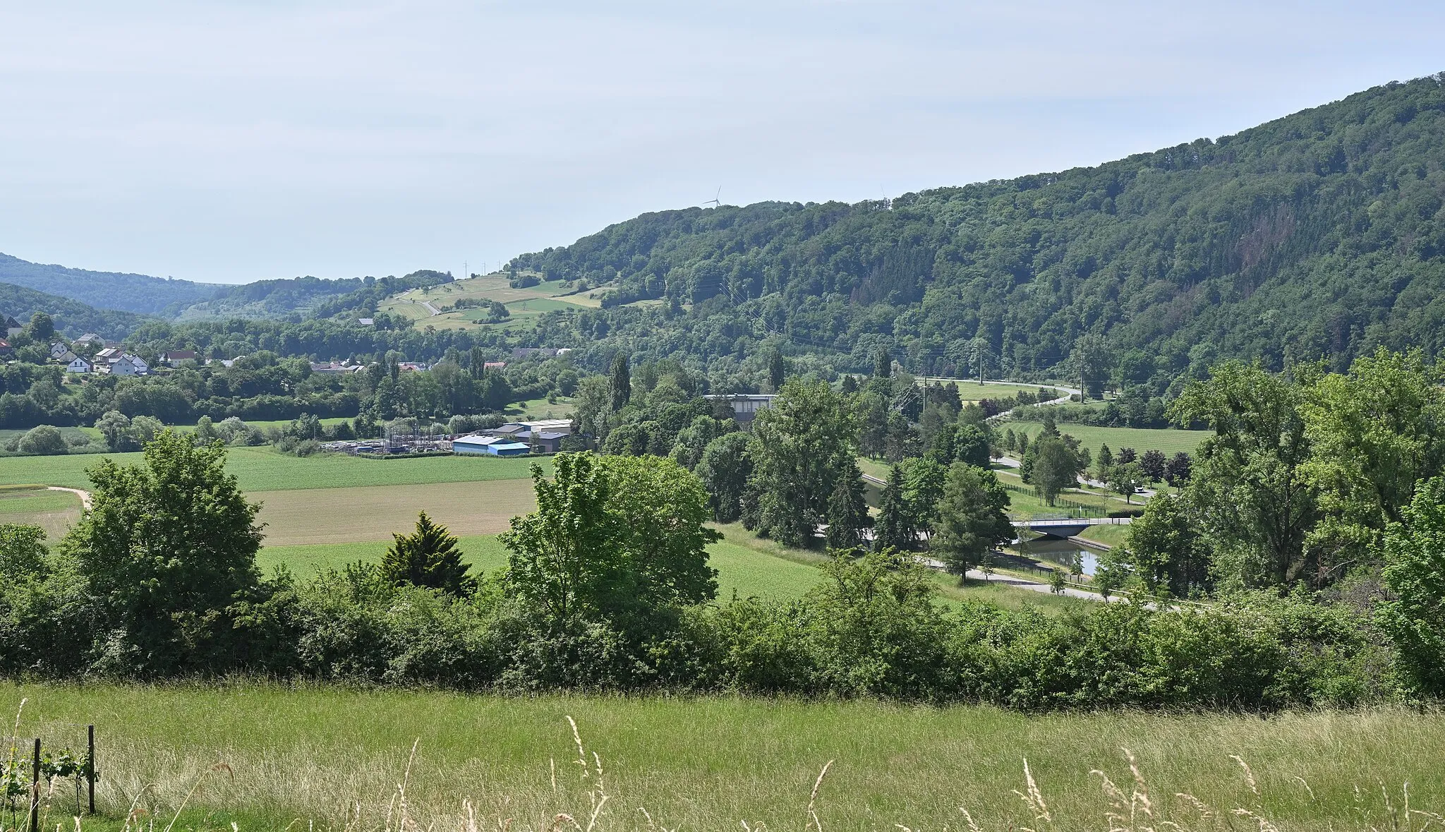 Photo showing: In the foreground: The nature reserve Rosport-Hëlt in Luxembourg. The hydroelectric power plant of Rosport is seen in the background.