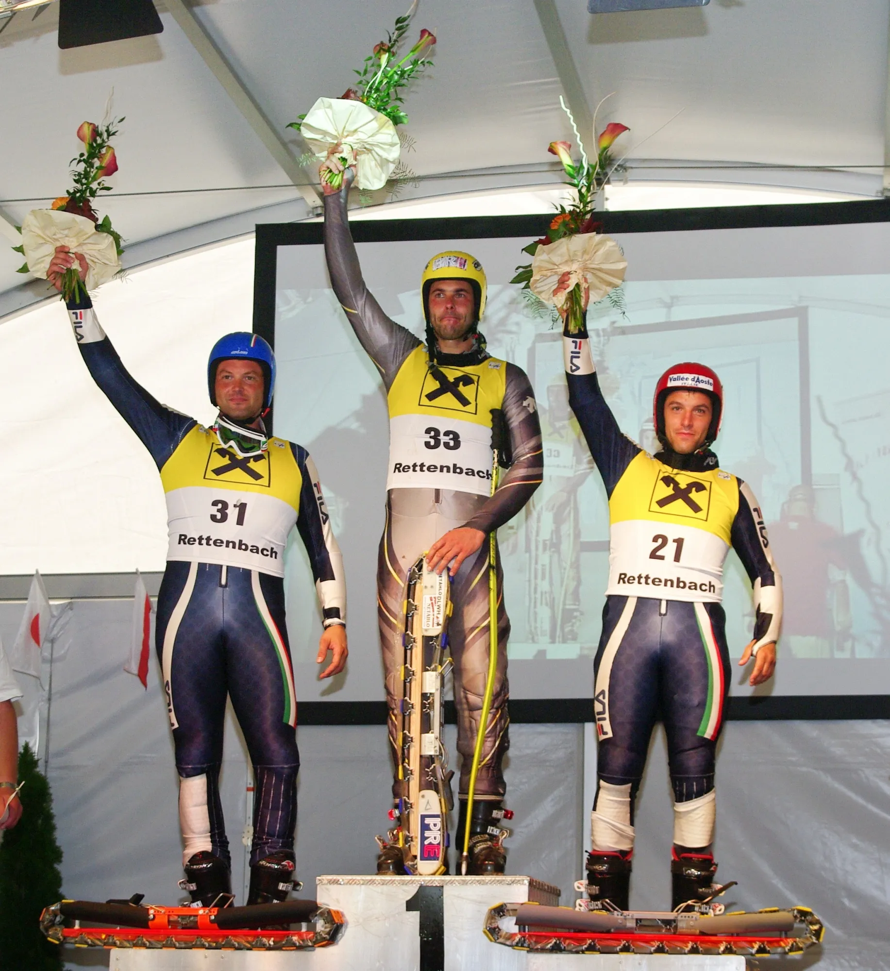 Photo showing: Grass Skiing World Championships 2009 in Rettenbach, Austria. Men's Giant Slalom, Flower Ceremony: 1st Place: Jan Němec (CZE), 2nd Place: Stefano Sartori (ITA), 3rd Place: Edoardo Frau (ITA)