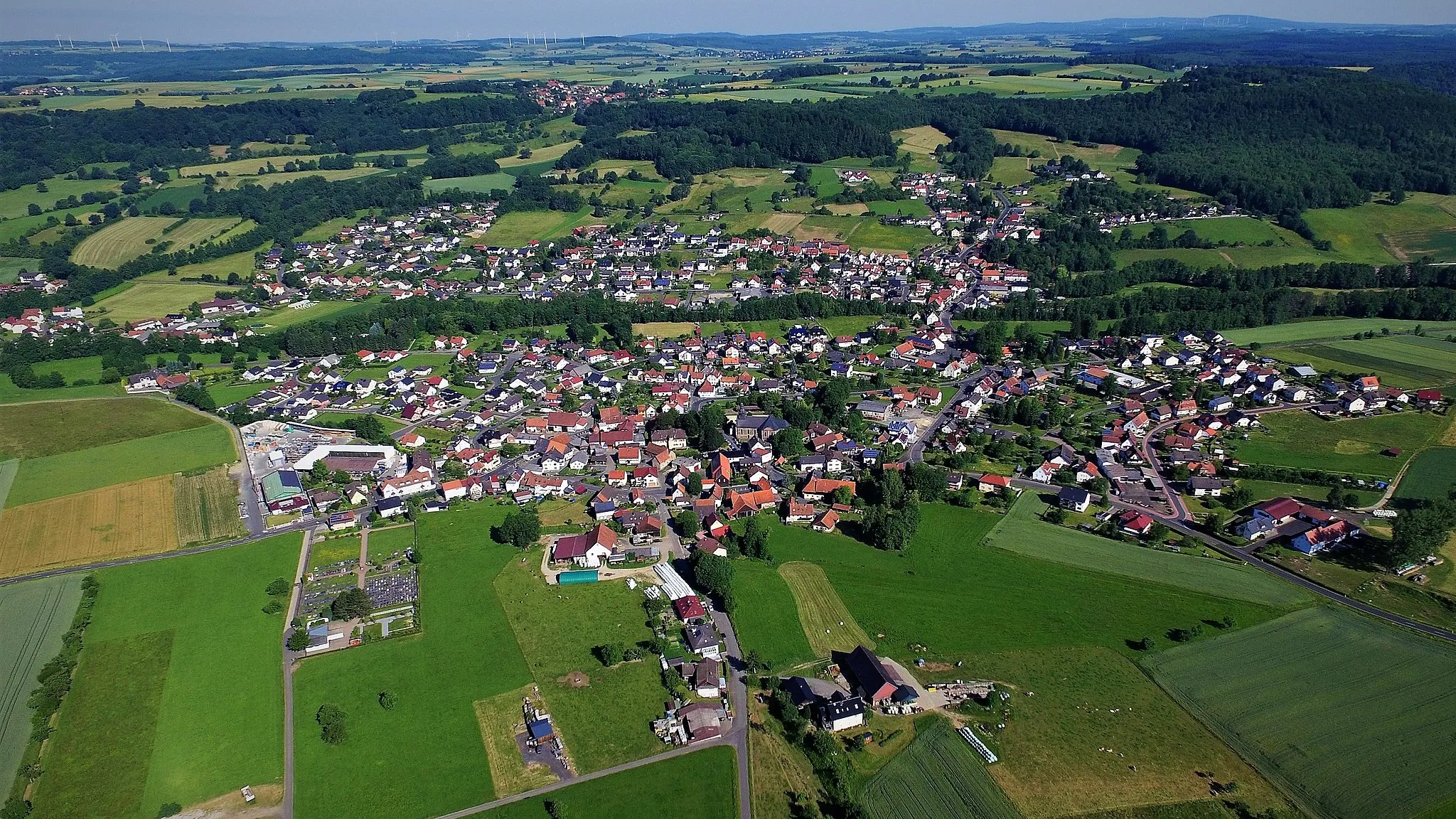Photo showing: Die drei Ortsteile Romsthal (mittig unten), Eckardroth (oben rechts) und Wahlert (oben links), die fast nahtlos ineinander übergehen.