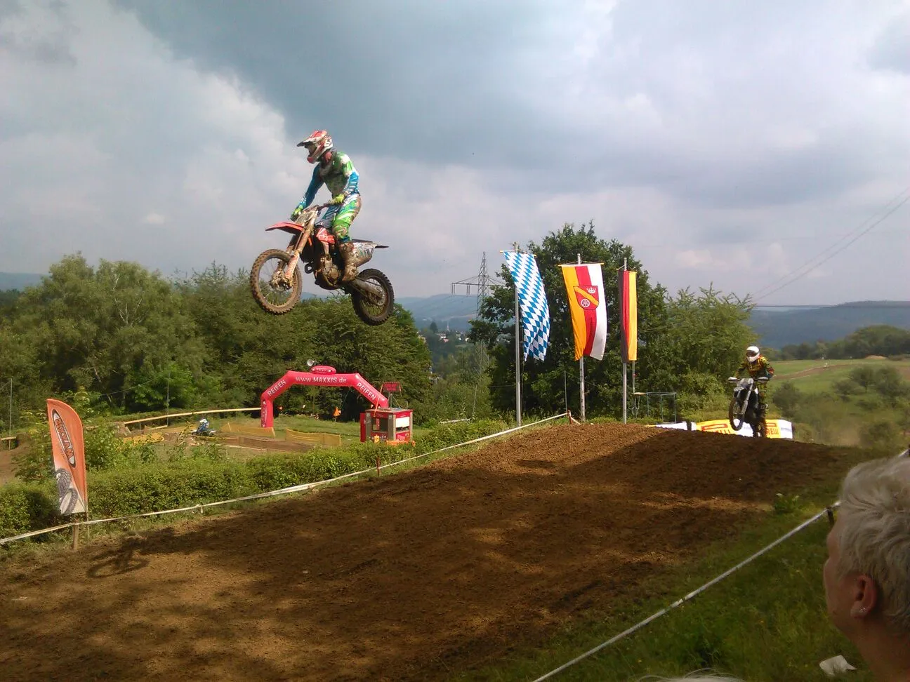 Photo showing: Motocross riders jumping in Goldbach, Lower Franconia, Germany