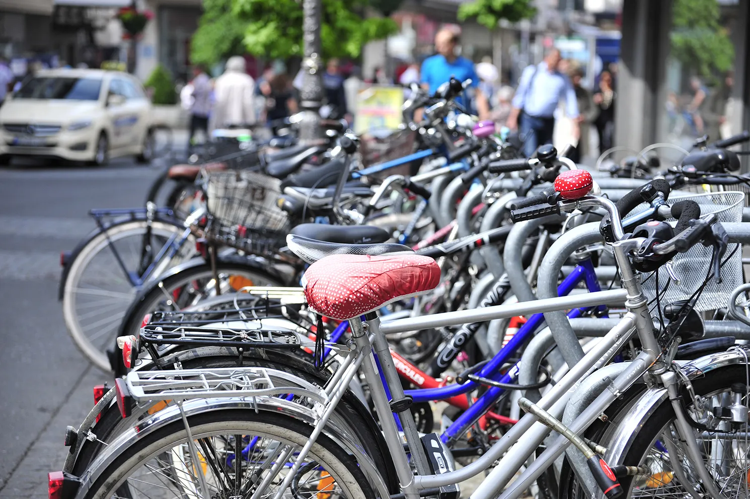 Photo showing: A cluster of bikes at a bicycle rack in Würzburg. This is a very common method of transportation in the city center.