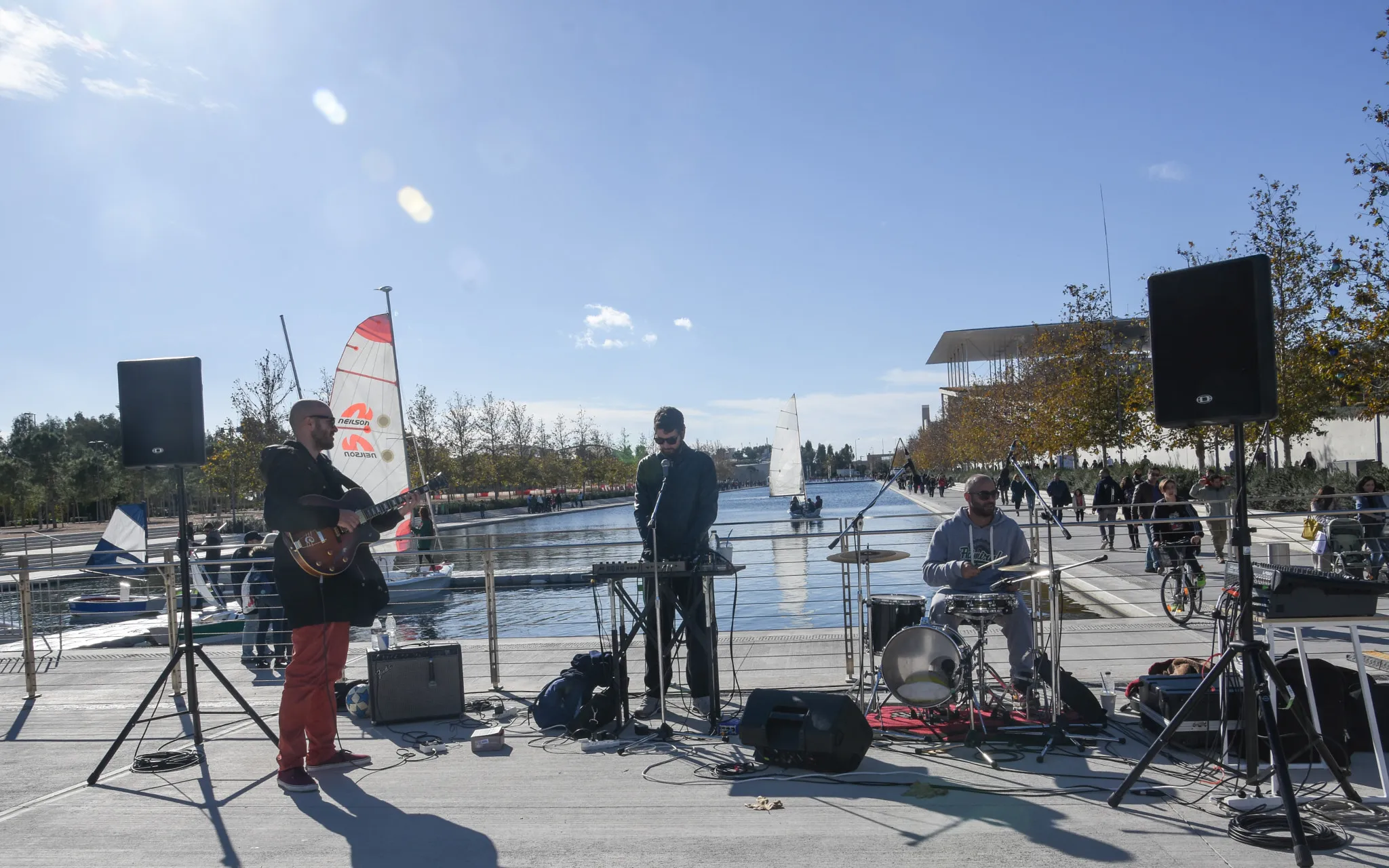 Photo showing: 500px provided description: Musical Performance In The Snfcc Canal Athens [#sky ,#water ,#clouds ,#sailing ,#canal ,#band ,#sun flare ,#sailing boat ,#recreation ,#leisure time ,#musical performance ,#Greece ,#Athens ,#SNFCC ,#Stavros Niarchos Foundation Cultural Center]