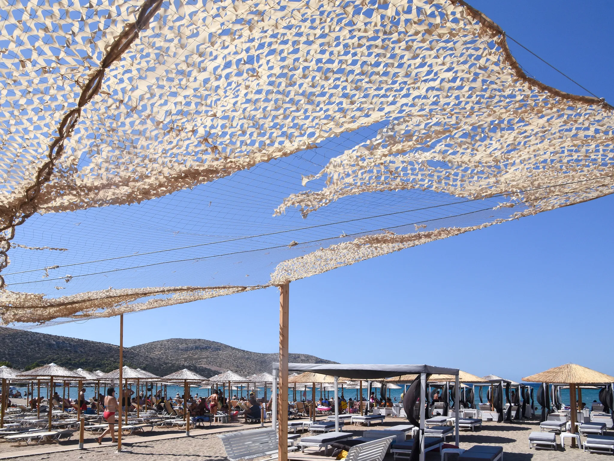 Photo showing: 500px provided description: A view of the beach in Anavissos, Attiki, Greece [#sky ,#sea ,#umbrella ,#beach ,#hill ,#tent ,#Greece ,#Attiki ,#Anavissos]