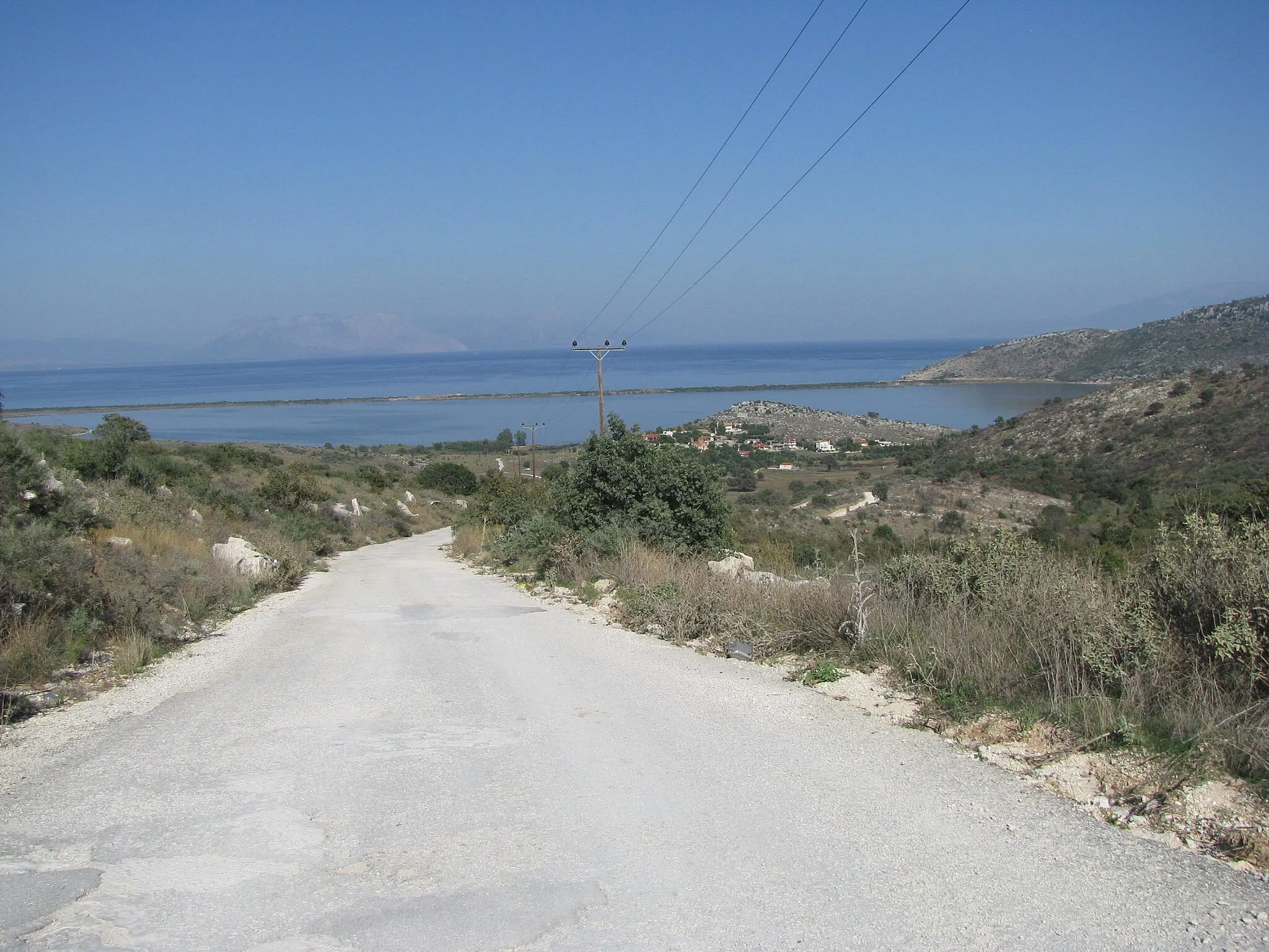 Photo showing: The road between Akrotirio Araxos and Gianiskari beach. The Papas lagoon in the background.