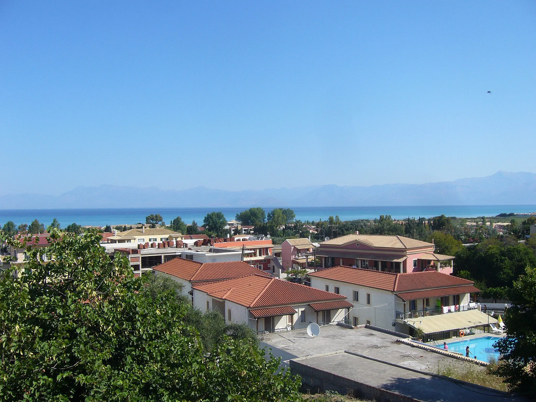 Photo showing: Acharavi village on the Greek island of Corfu. In the backgroung locate Ionian Sea and Albania.