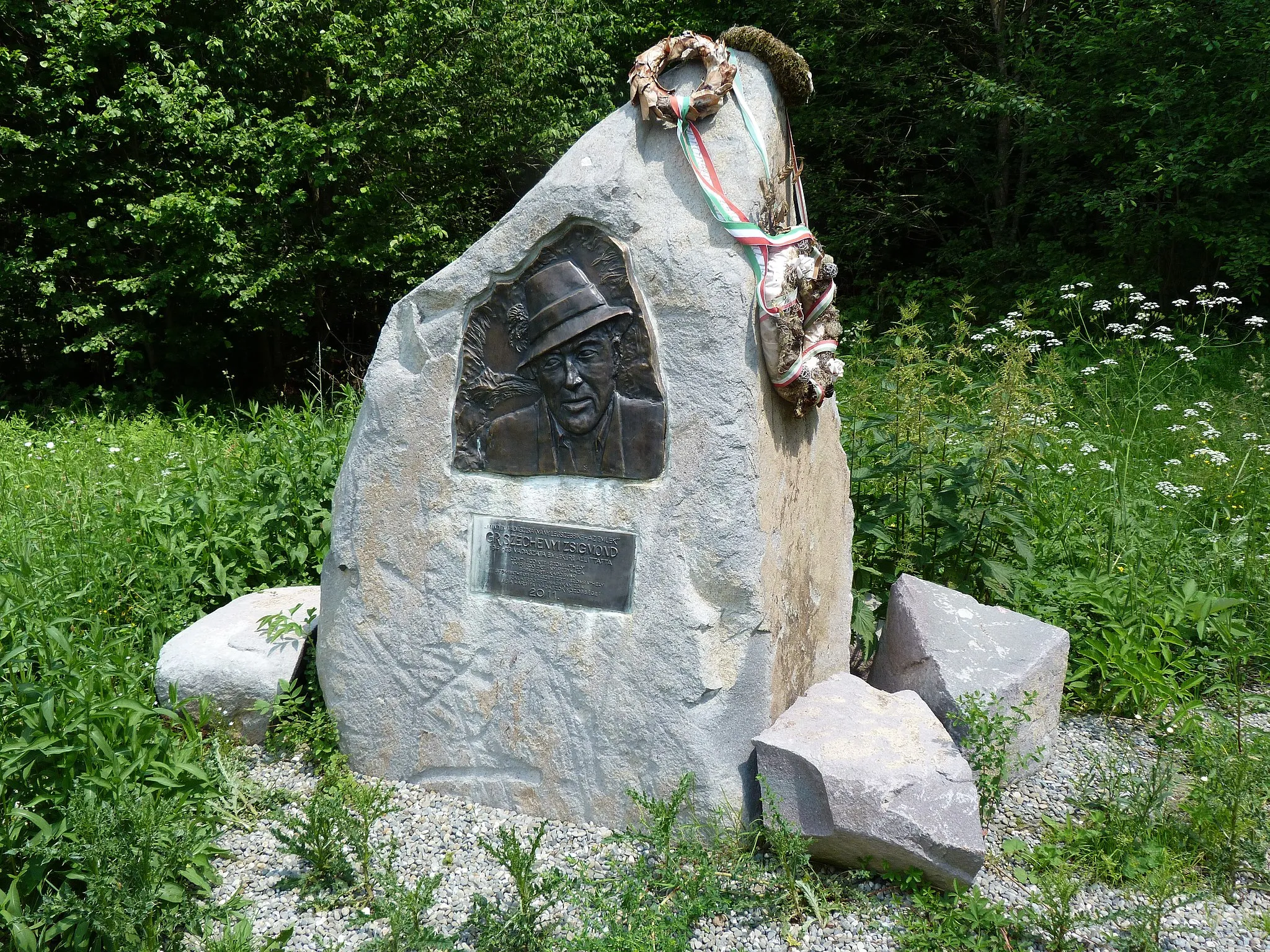 Photo showing: Live on the 17th of June, 2013. Hargita Mountain, the holy mountain of the Székely People  (1801m) is the highest peak of the Hargita Mountain chain. One can reach it by foot in the valley of the Ivo stream. Ivo crossroad – the statue of gróf Széchenyi Zsigmond. A felvétel 2013. június 17 -én, hétfőn készült a Hargitán. Ivó pataka. Az Ivó patak völgyében haladva közelíthető meg a Hargita csúcsa (1801 méter). Az Ivó völgye a Madarasi Hargita lábánál. Gróf Széchenyi Zsigmond szobra. A Madarasi Hargitára 14 km-es gyalogúton is fel lehet jutni.  A Gróf Széchenyi Zsigmond szobránál levő elágazásnál jobbra fordulva cca 2-3 km-es, erősen emelkedő szakaszon még járható személygépkocsival az út, innen kezdve azonban nem. A Madarasi Hargita emlékház 1675 m-es magasságban van. ©© Derzsi Elekes Andor, Budapest, 2013, You are authorised to use these photos and vids under Creative Commons -- even for commercial, for profit purposes. Photos must be attributed to Derzsi Elekes Andor. All of the photos and vids in the Metapolisz DVD line are under Creative Commons and can be used even for commercial -- for profit -- purposes. Recommended Citation Derzsi Elekes Andor: Metapolisz DVD line http://nektar.oszk.hu/en/manifestation/2623913 Time: Mashine time + 1 hour