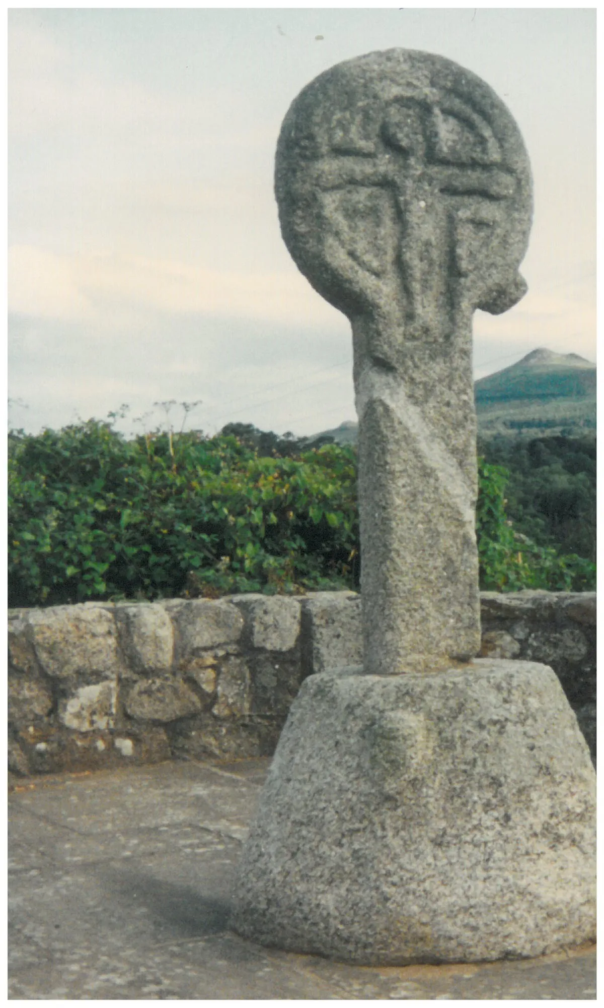Photo showing: A simple carved stone celtic style cross in Enniskerry. Sugarloaf peak is in the background.