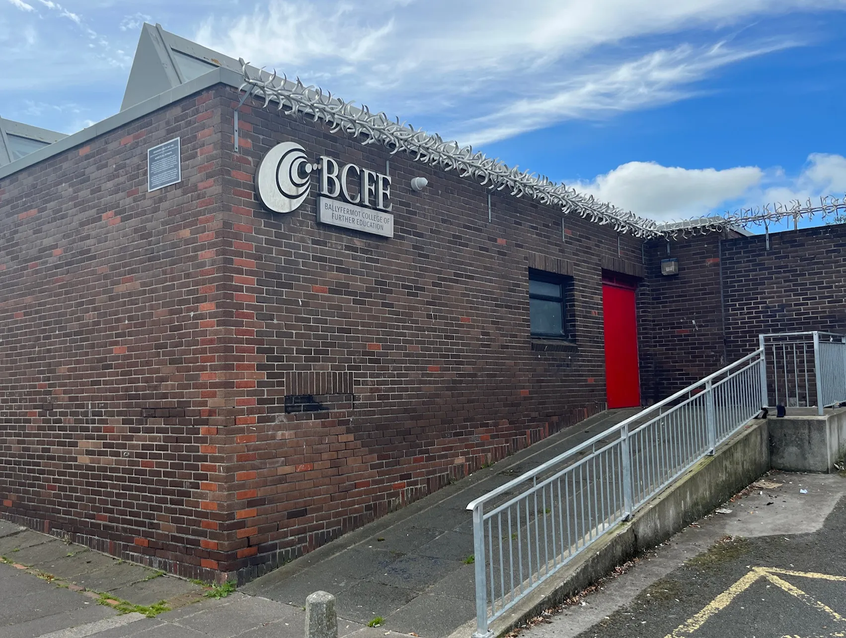 Photo showing: Ballyfermot College of Further Education - main building, near the area's centre - entrance with ramp / emergency exit, with college logo