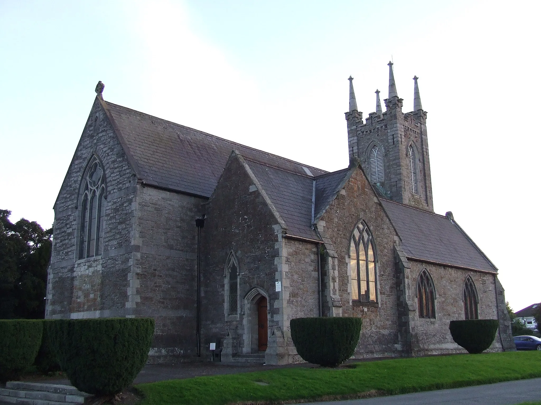 Photo showing: St Brigit's church, property of the Church of Ireland, in the village of Castleknock. Sunset, September 2012.