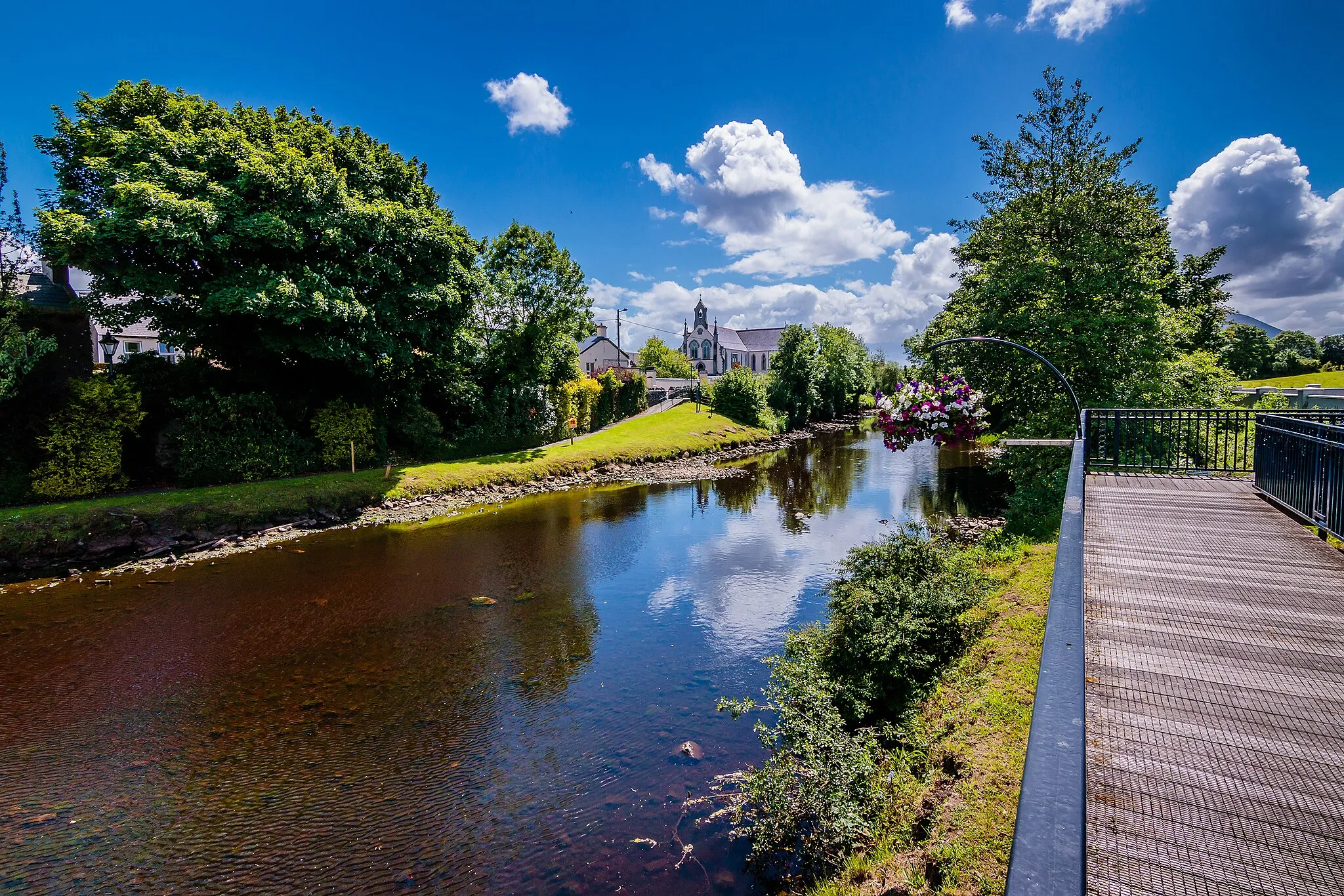 Photo showing: View of the Deel River in the town of Crossmolina. In the distance is Saint Tiernan's Church.