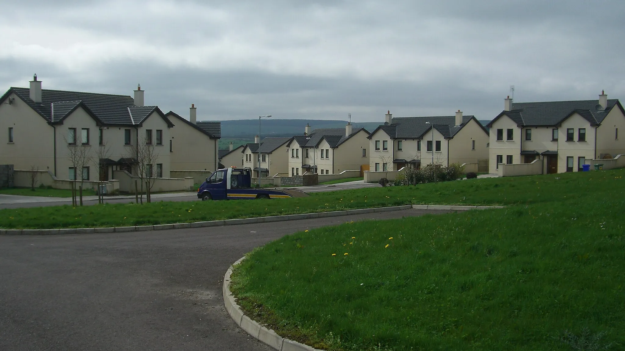 Photo showing: These houses are sparsely occupied and are a product of the Irish housing bubble.