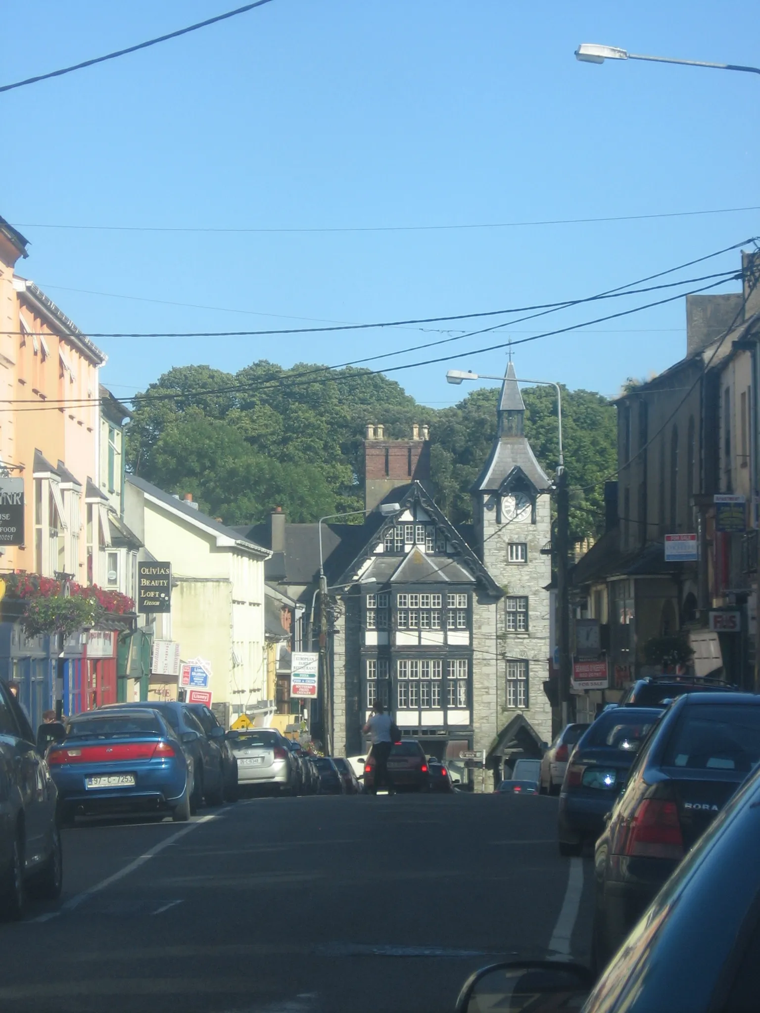 Photo showing: Main Street, Mallow, Co. Cork, Ireland. Featuring the clock tower at the junction of The Spa and Bridge Street.