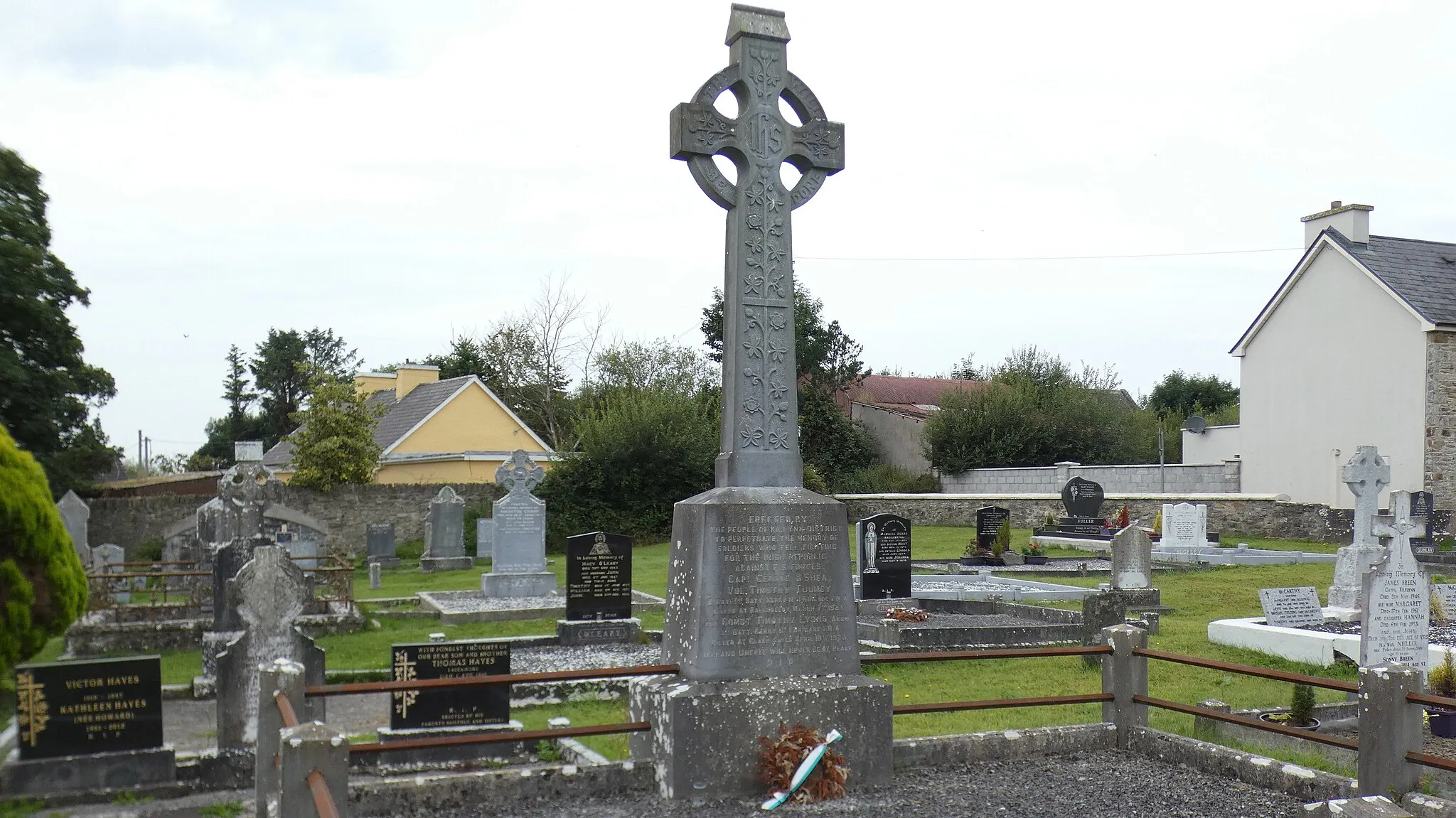 Photo showing: The Republican plot in the graveyard of St. Columba's Heritage Centre, Kilflynn, Ireland. George O'Shea, Timothy Tuomey and Timothy Lyons lie here.